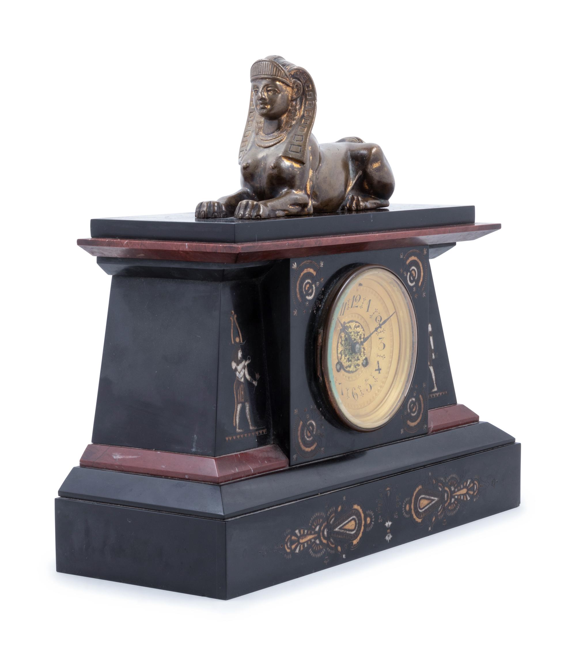 An Egyptian Revival Bronze Mounted and Parcel Gilt Mantel Clock