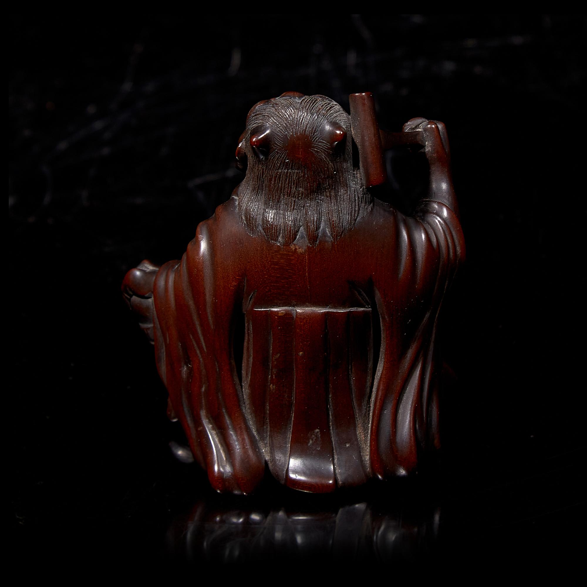 A Japanese Carved Boxwood "Oni" Okimono, Meiji Period
