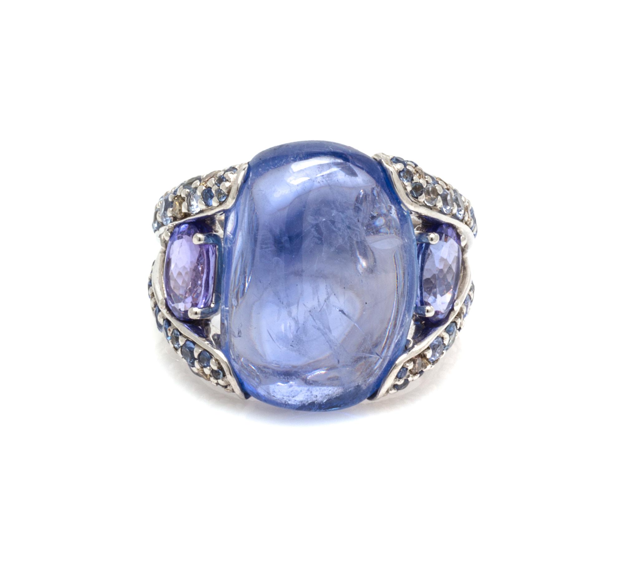 An 18 Karat White Gold, Sapphire, Tanzanite and Diamond Ring, 8.30 dwts.