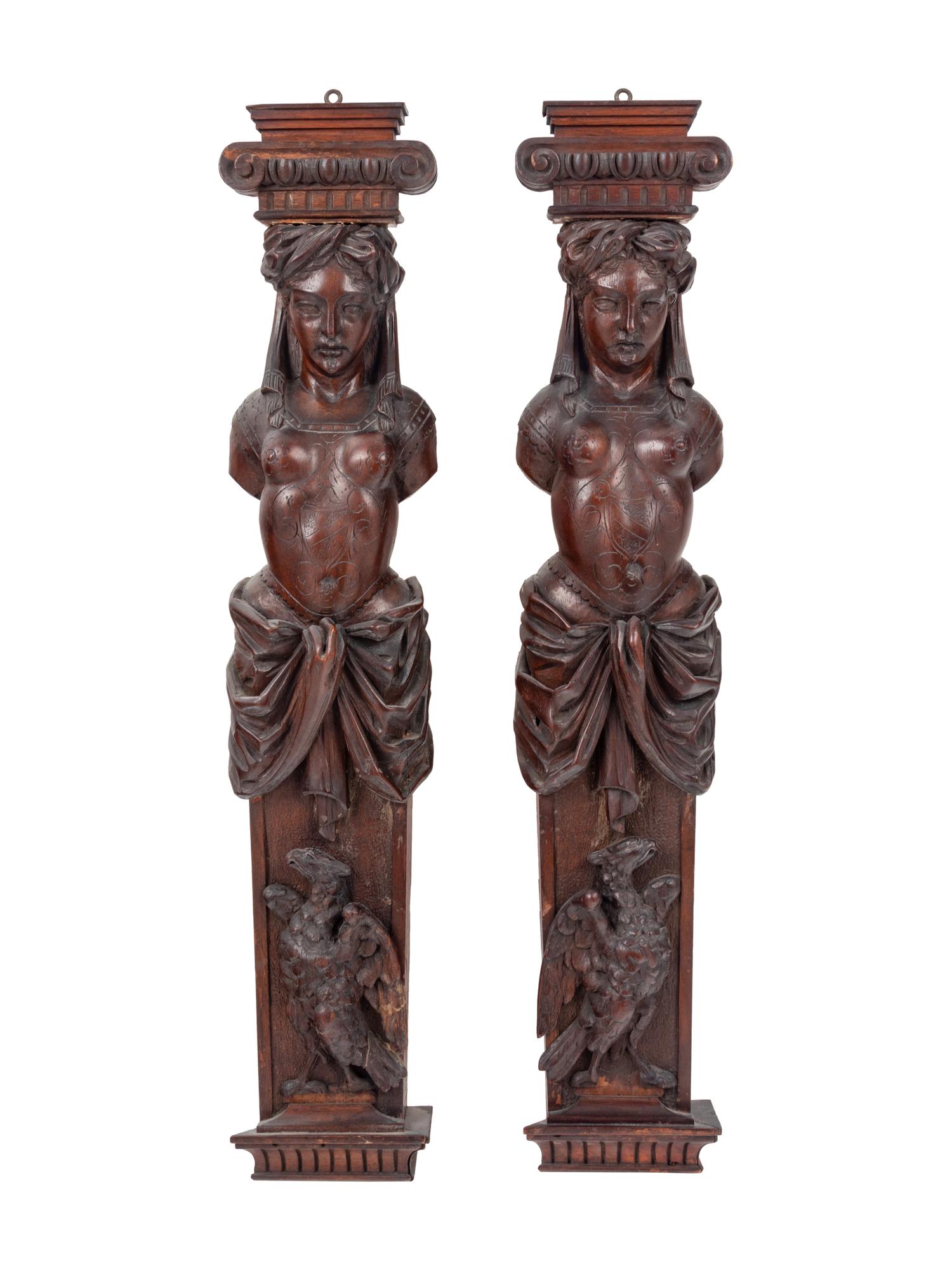 A Pair of French Carved Walnut Figural Ornaments