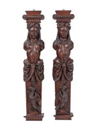 A Pair of French Carved Walnut Figural Ornaments