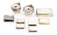 A Group of Eight Silver Smoking Articles, , consisting of five match box sleeves, two ash receivers, a match box, together with a silve