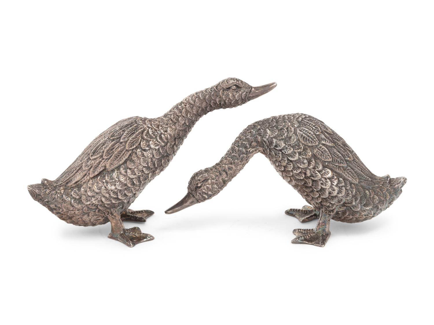 Two Silver Duck Figures