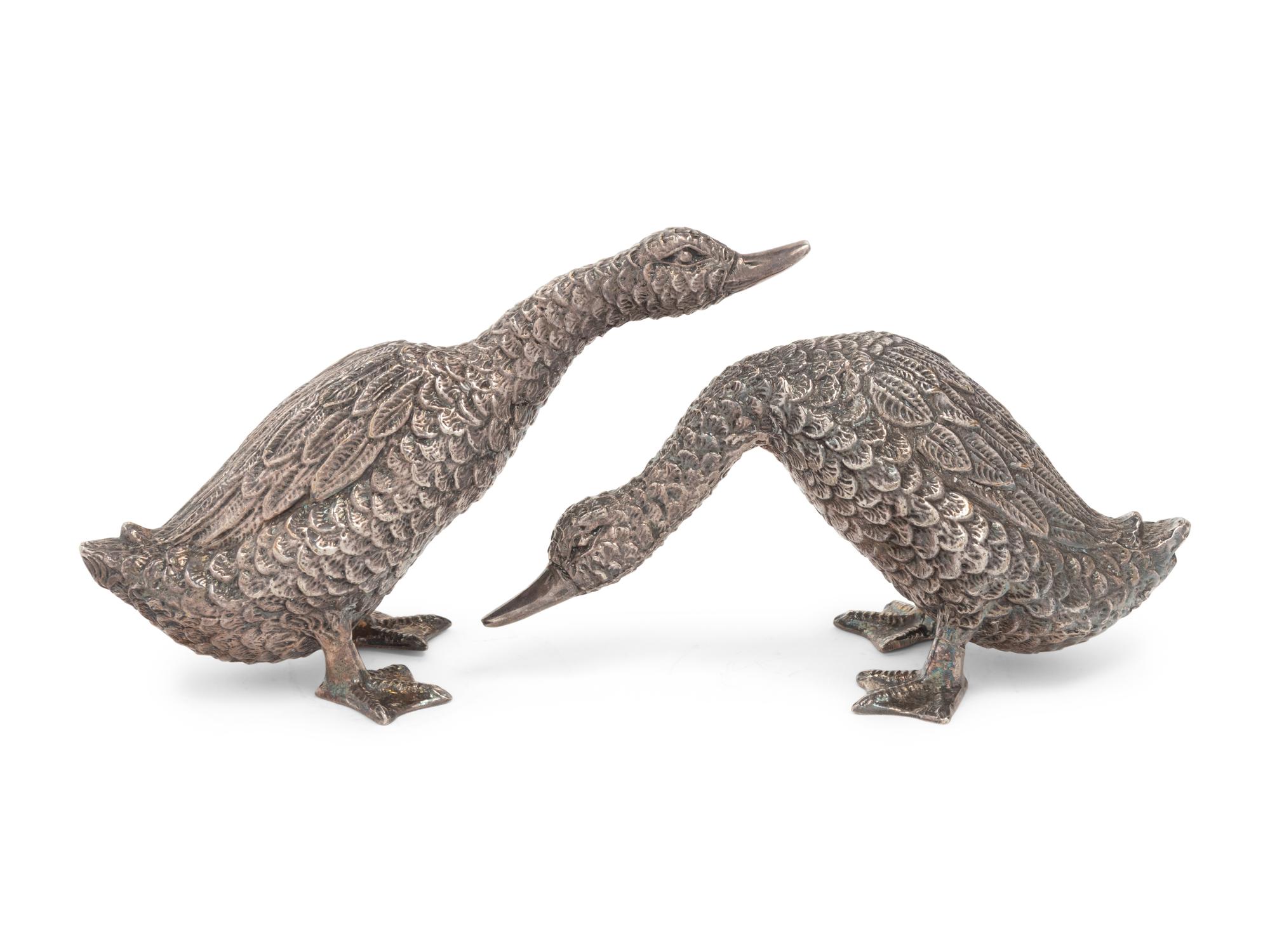 Two Silver Duck Figures