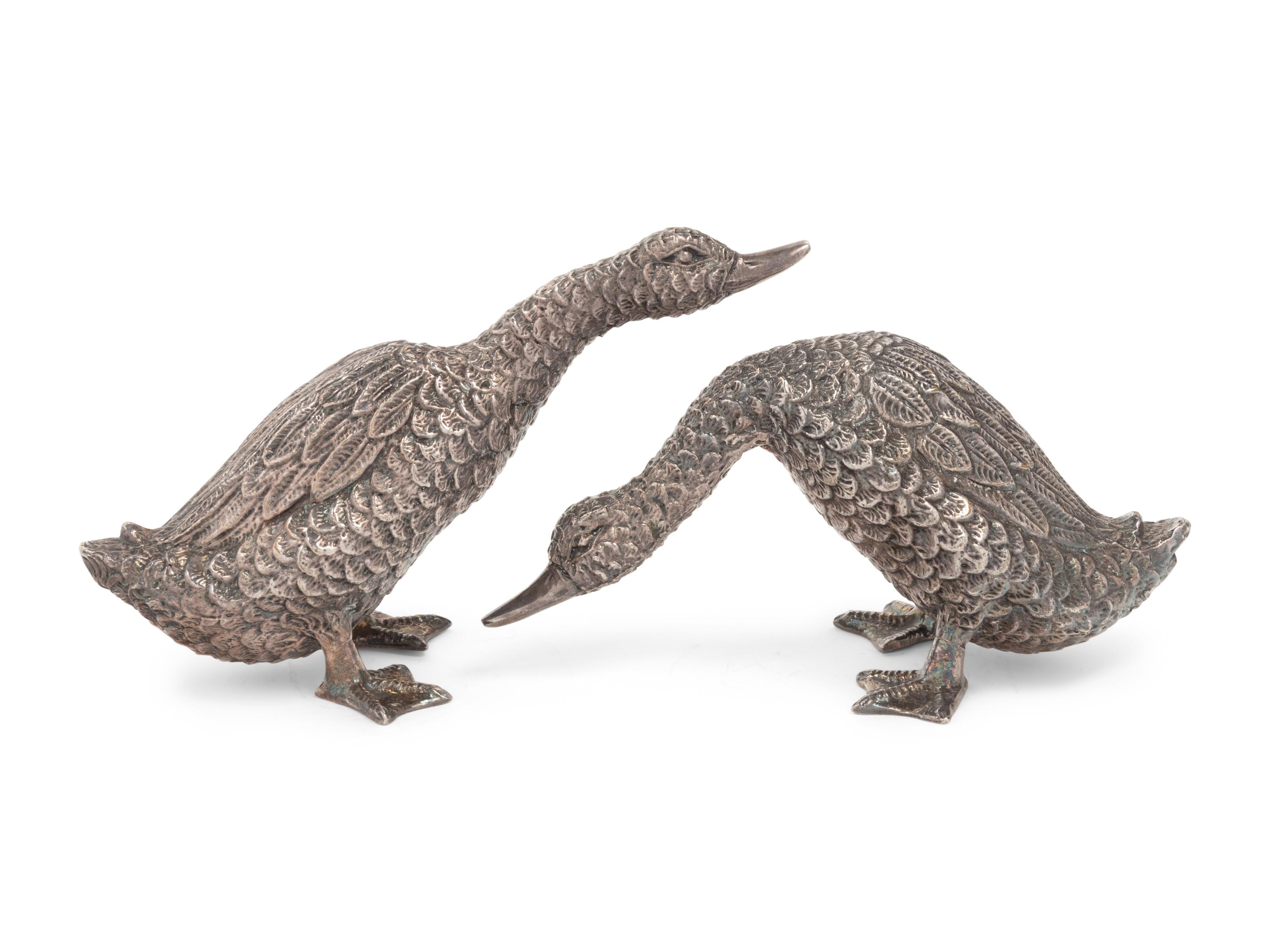 Two Silver Duck Figures