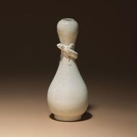 A Chinese White Glazed Porcelain 'Chilong' Bottle Vase, Qing Dynasty — 清 白釉盤螭龍瓶