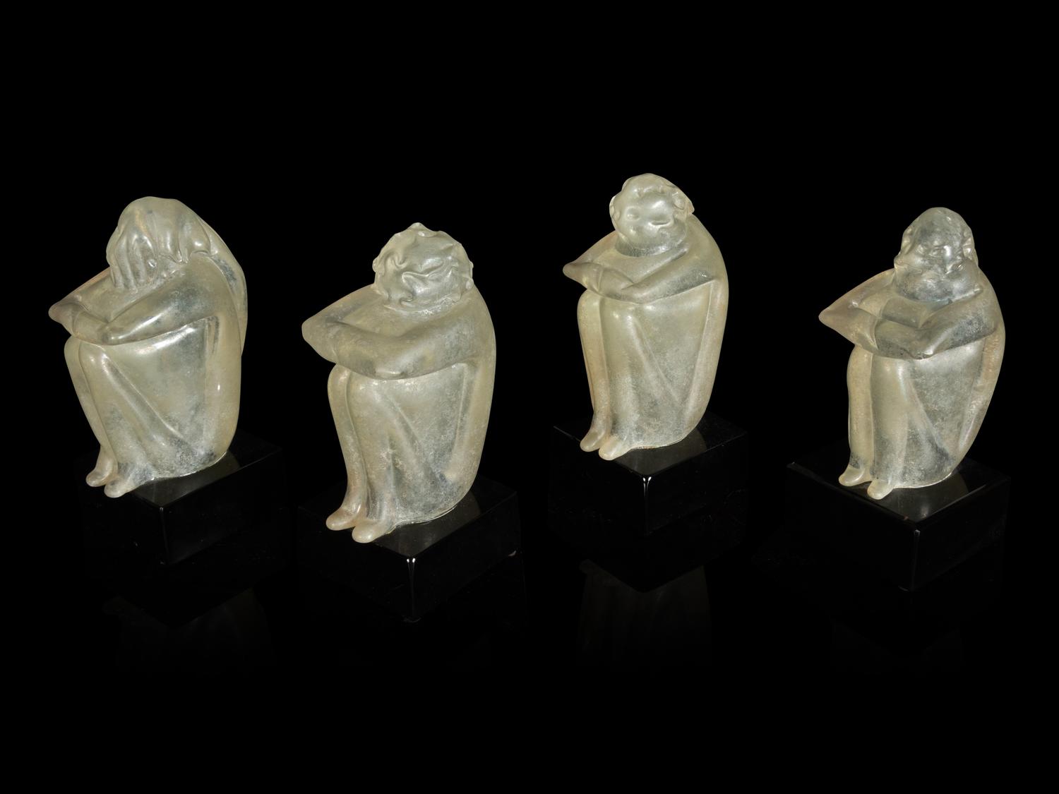 A Group of Four Glass Figural Groups