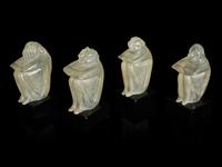A Group of Four Glass Figural Groups