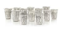 A Group of Eleven Russian Silver Beakers, Various Makers, Late 19th/Early 20th Century, each having a flared rim, the bodies worked to