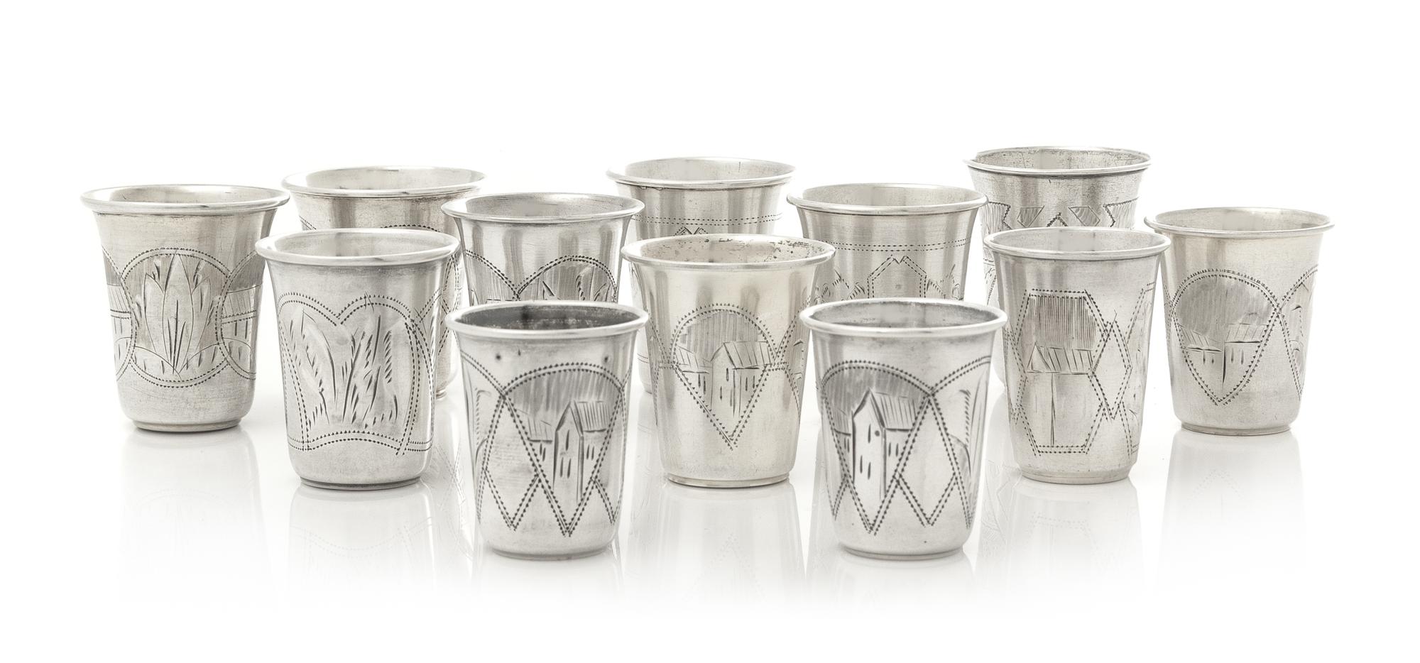 A Group of Eleven Russian Silver Beakers, Various Makers, Late 19th/Early 20th Century, each having a flared rim, the bodies worked to