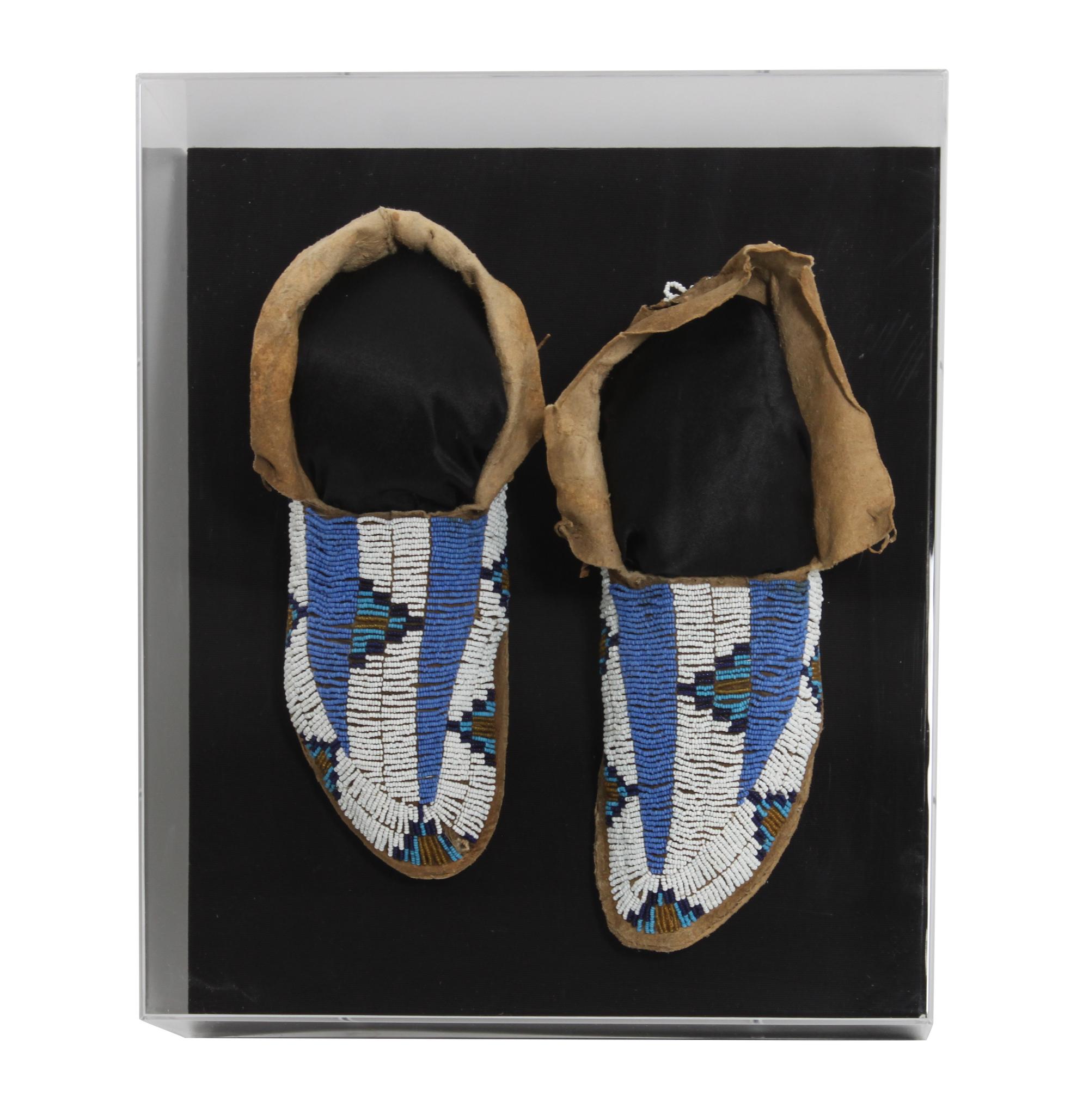 A Pair of Sioux Mocassins Length 11 inches — FIRST QUARTER 20TH CENTURY