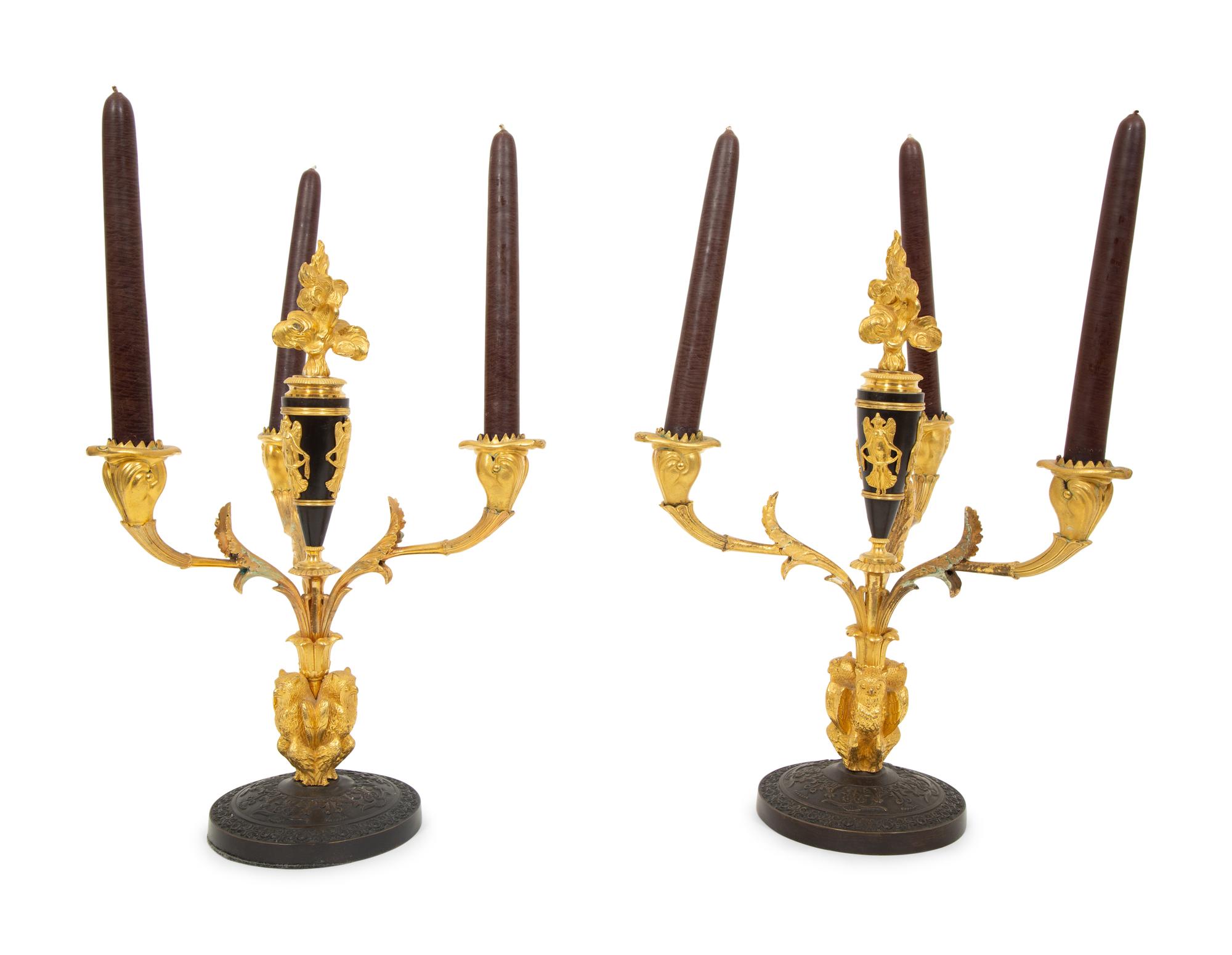 A Pair of Empire Style Gilt and Patinated Bronze Three-Light Candelabra