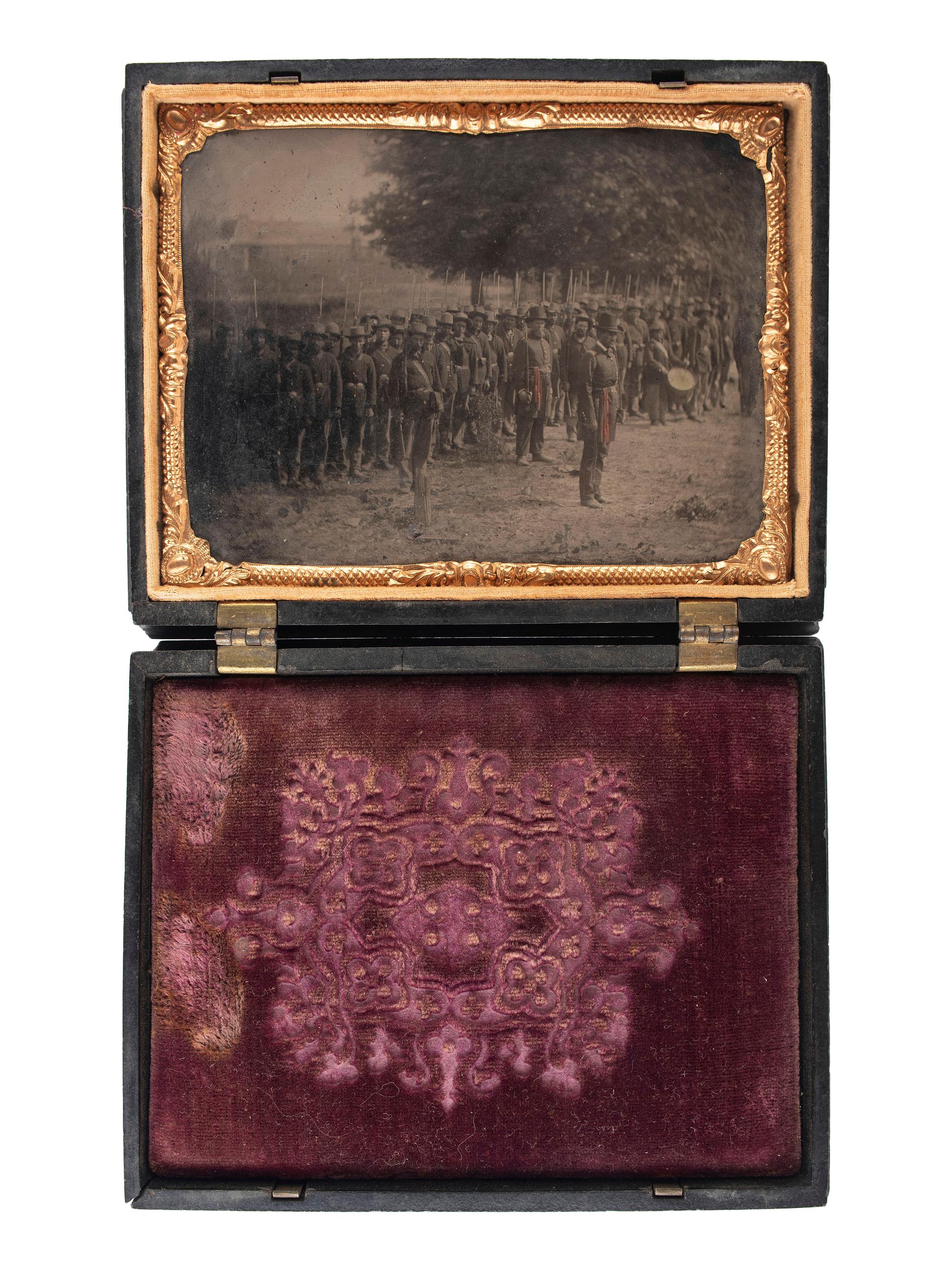 [CIVIL WAR]. Quarter plate tintype of Union officers leading western Infantry company. N.p.: N.p., [1861-1865].