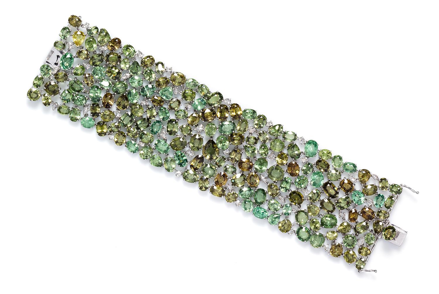 An 18 Karat White Gold, Demantoid Garnet and Diamond Bracelet, 59.80 dwts.