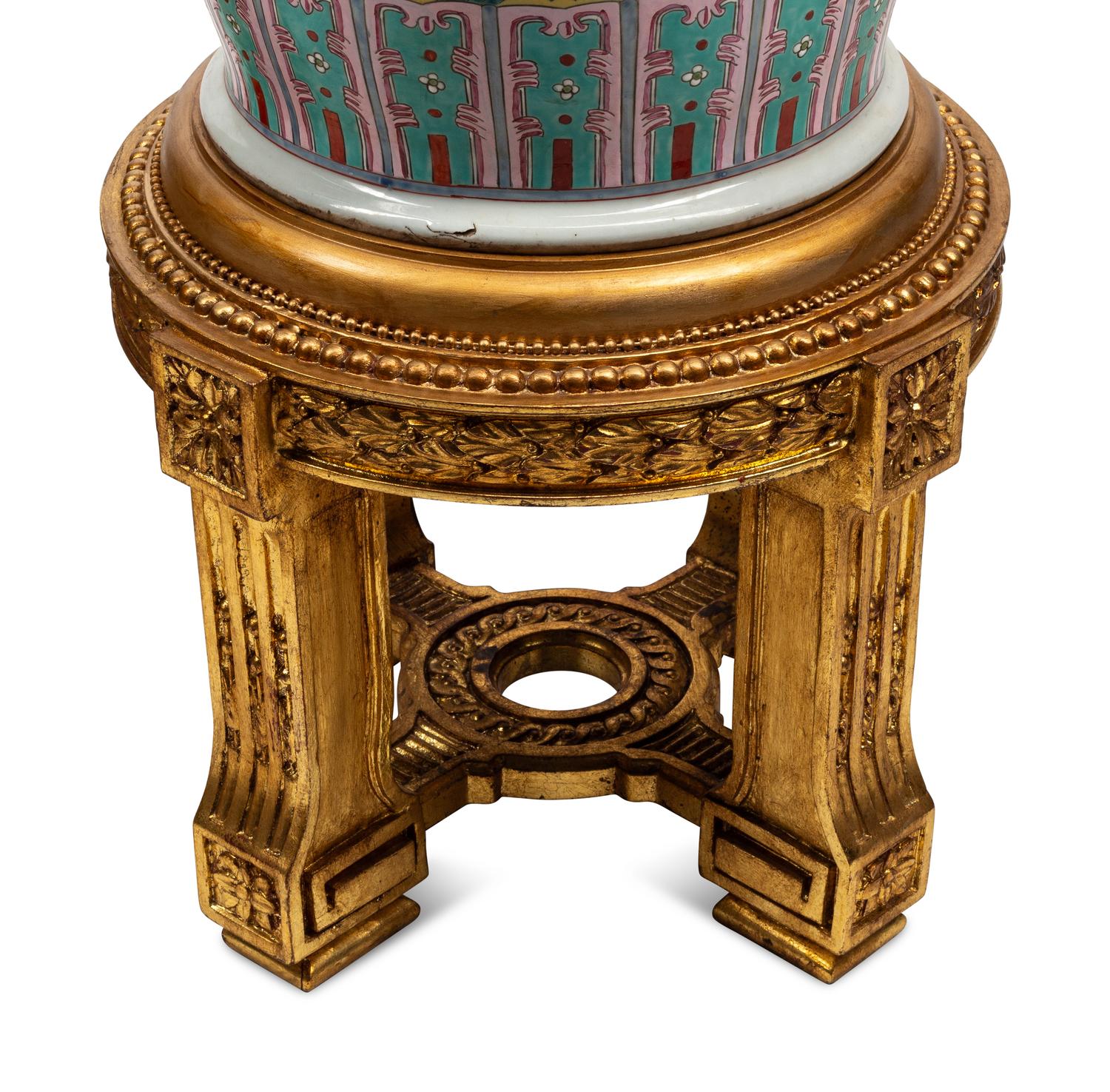 A Pair of Monumental Famille Jaune Porcelain Vases on Giltwood Stands