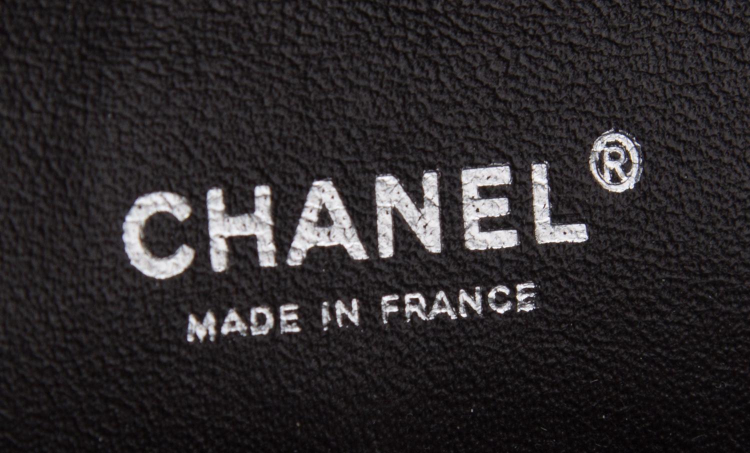 A Chanel Brown Caviar Leather Double Flap Handbag, 10" x 6.5" x 2.5".