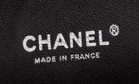 A Chanel Brown Caviar Leather Double Flap Handbag, 10" x 6.5" x 2.5".
