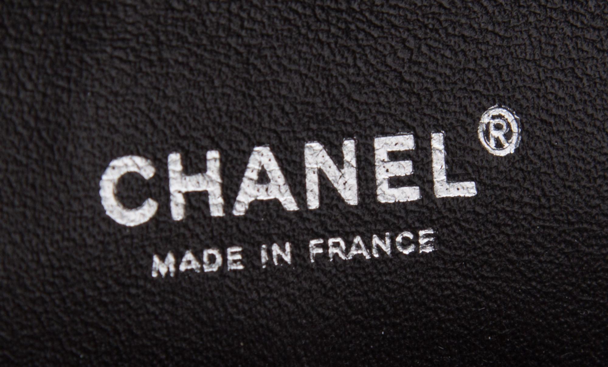 A Chanel Brown Caviar Leather Double Flap Handbag, 10" x 6.5" x 2.5".