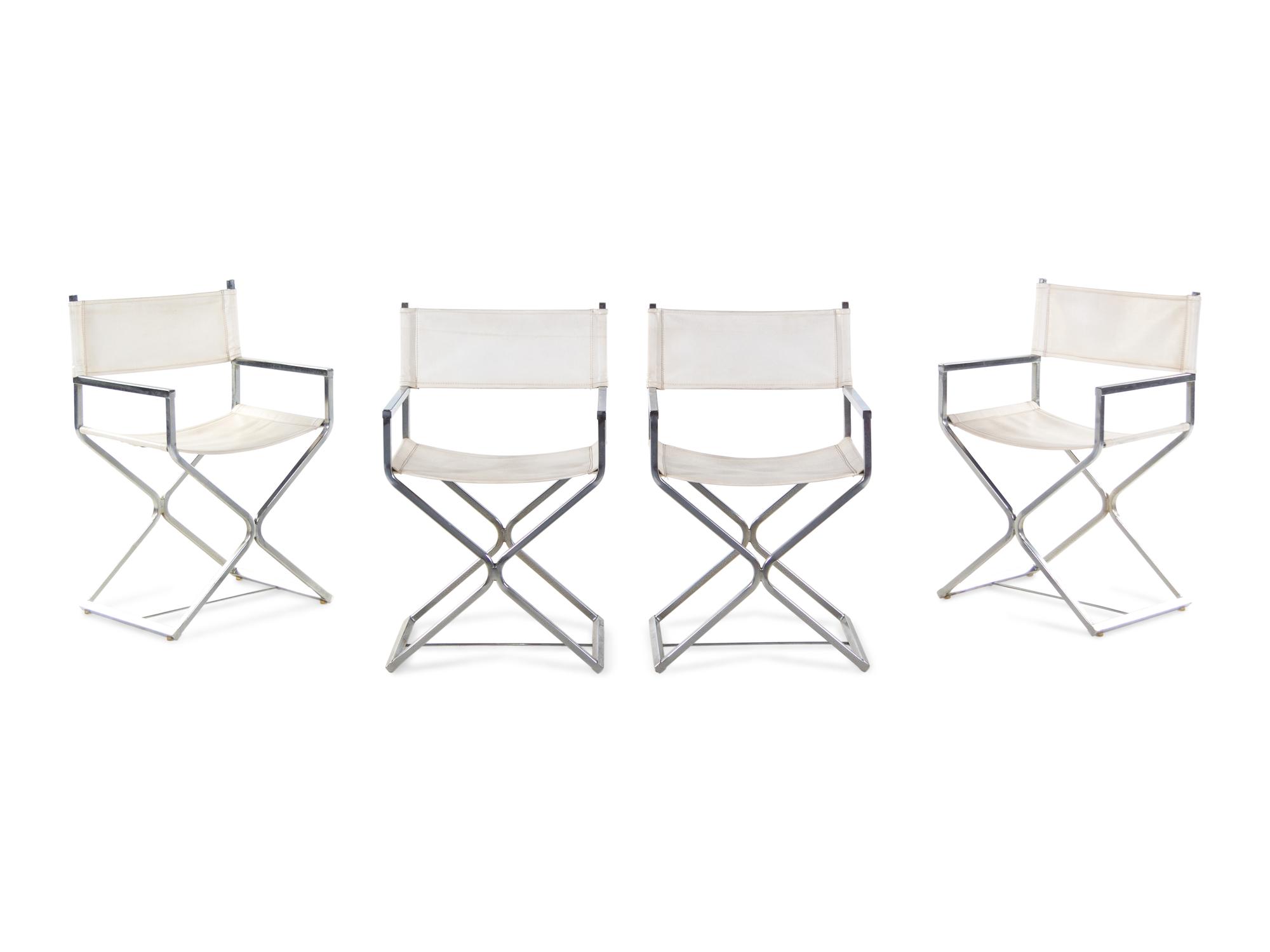 A Set of Four Campaign Style Chairs in the Style of Milo Baughman