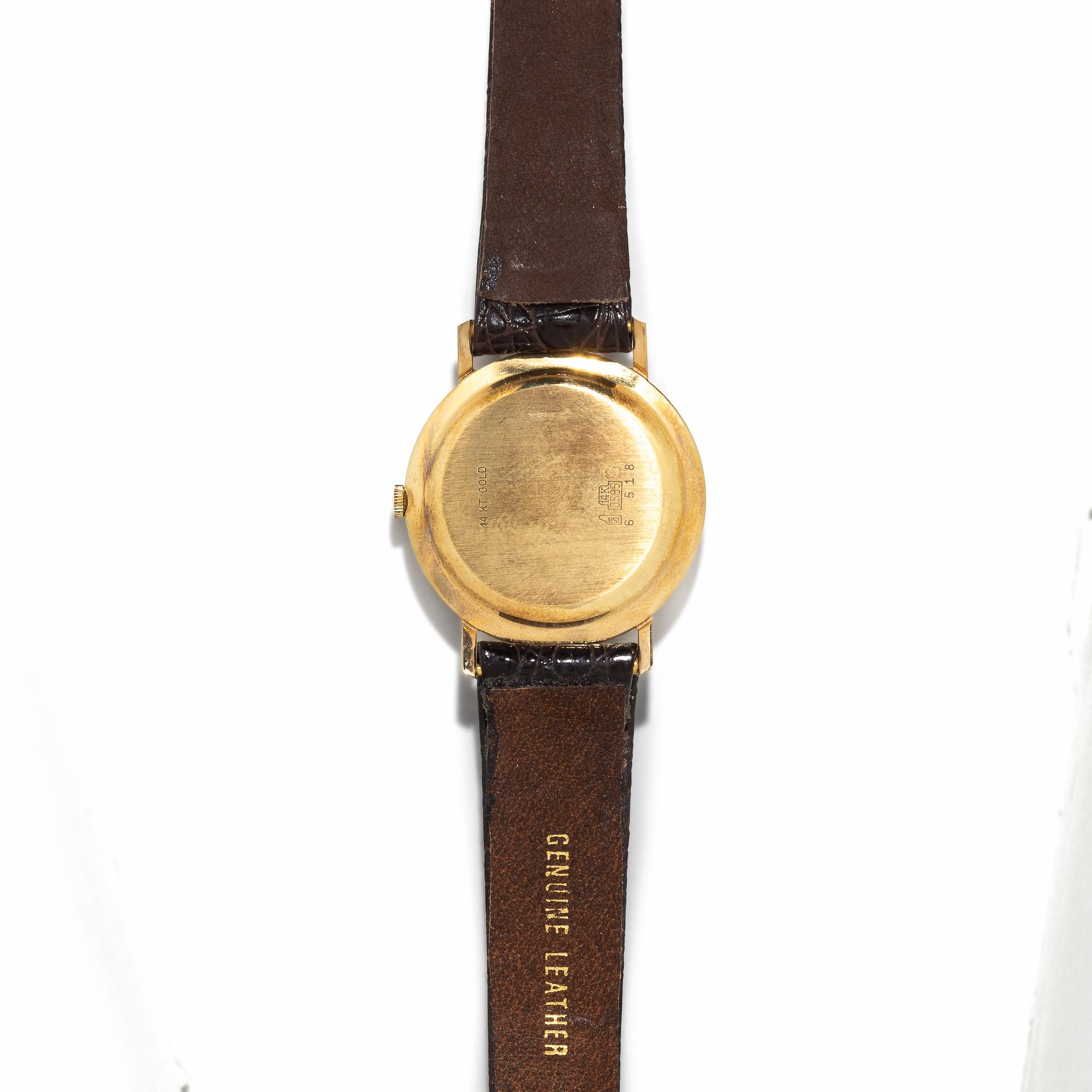 VULCAIN, 14K YELLOW GOLD WATCH