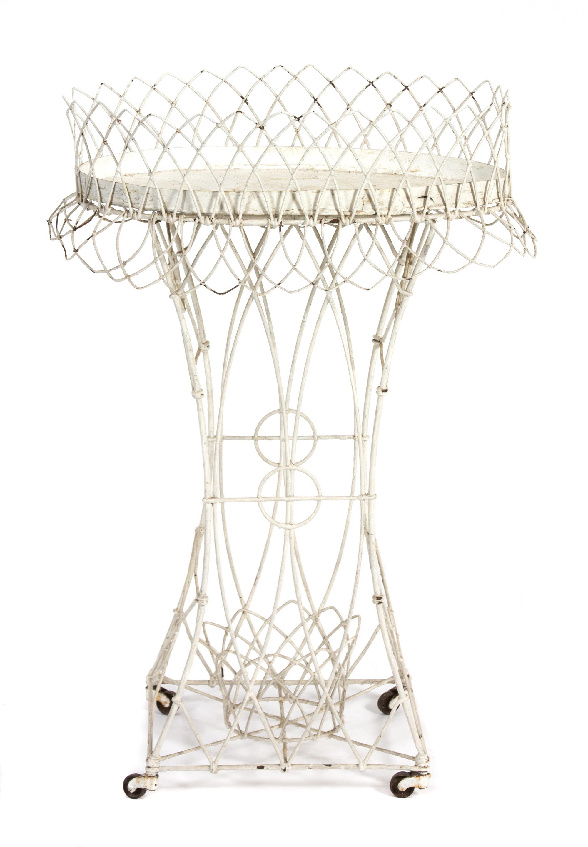 A Victorian Wirework Plant Stand Height 33 x width 23 x depth 14 inches. — LATE 19TH CENTURY