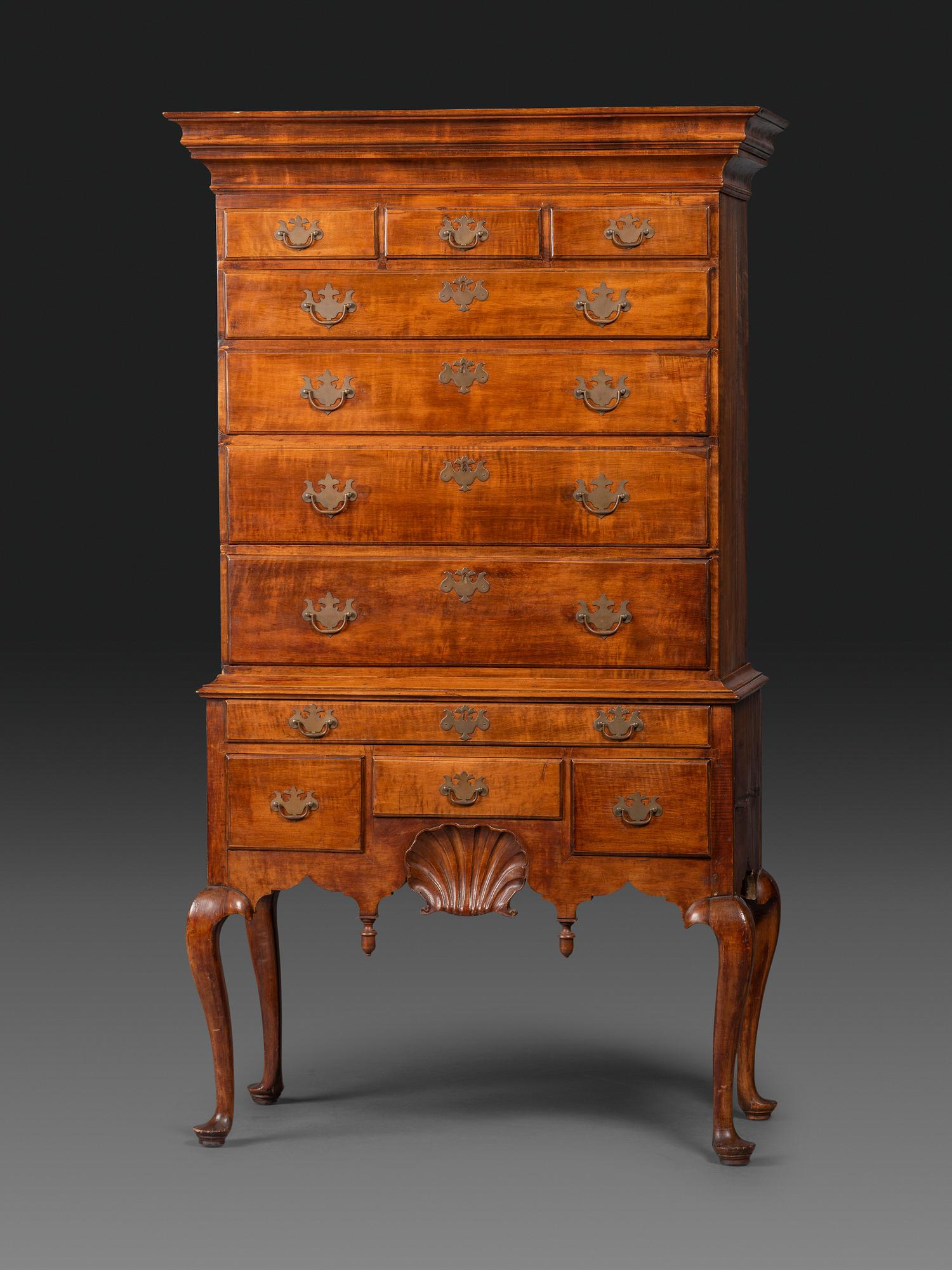 A Queen Anne Shell-Carved and Figured Maple Flat-Top High Chest of Drawers