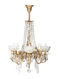 A Gilt Metal Eight Light Chandelier with Etched Glass Shades