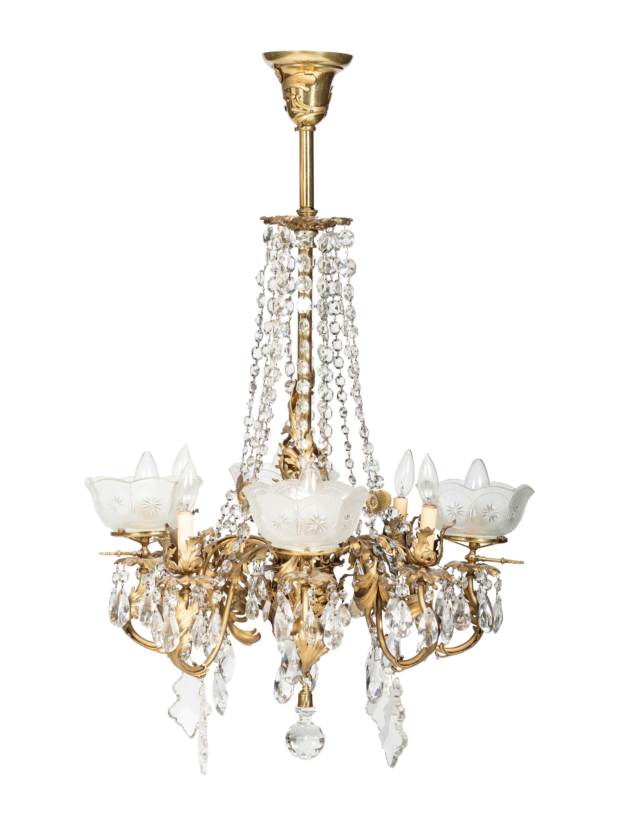 A Gilt Metal Eight Light Chandelier with Etched Glass Shades
