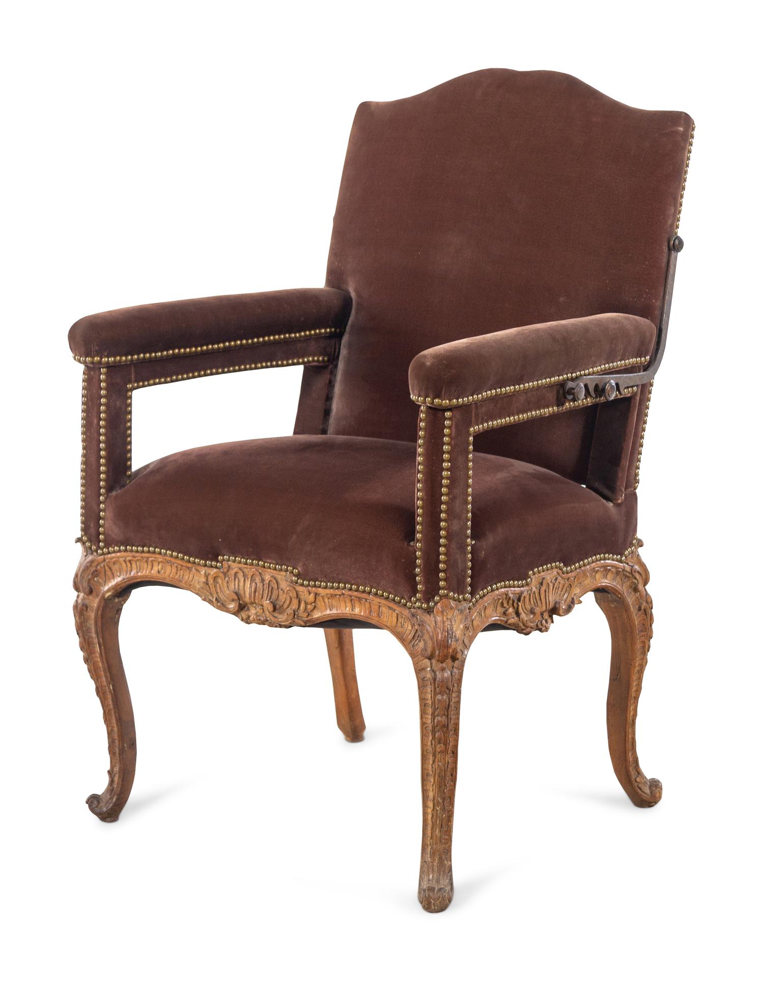 A Régence Velvet-Upholstered Carved Beechwood Reclining Armchair