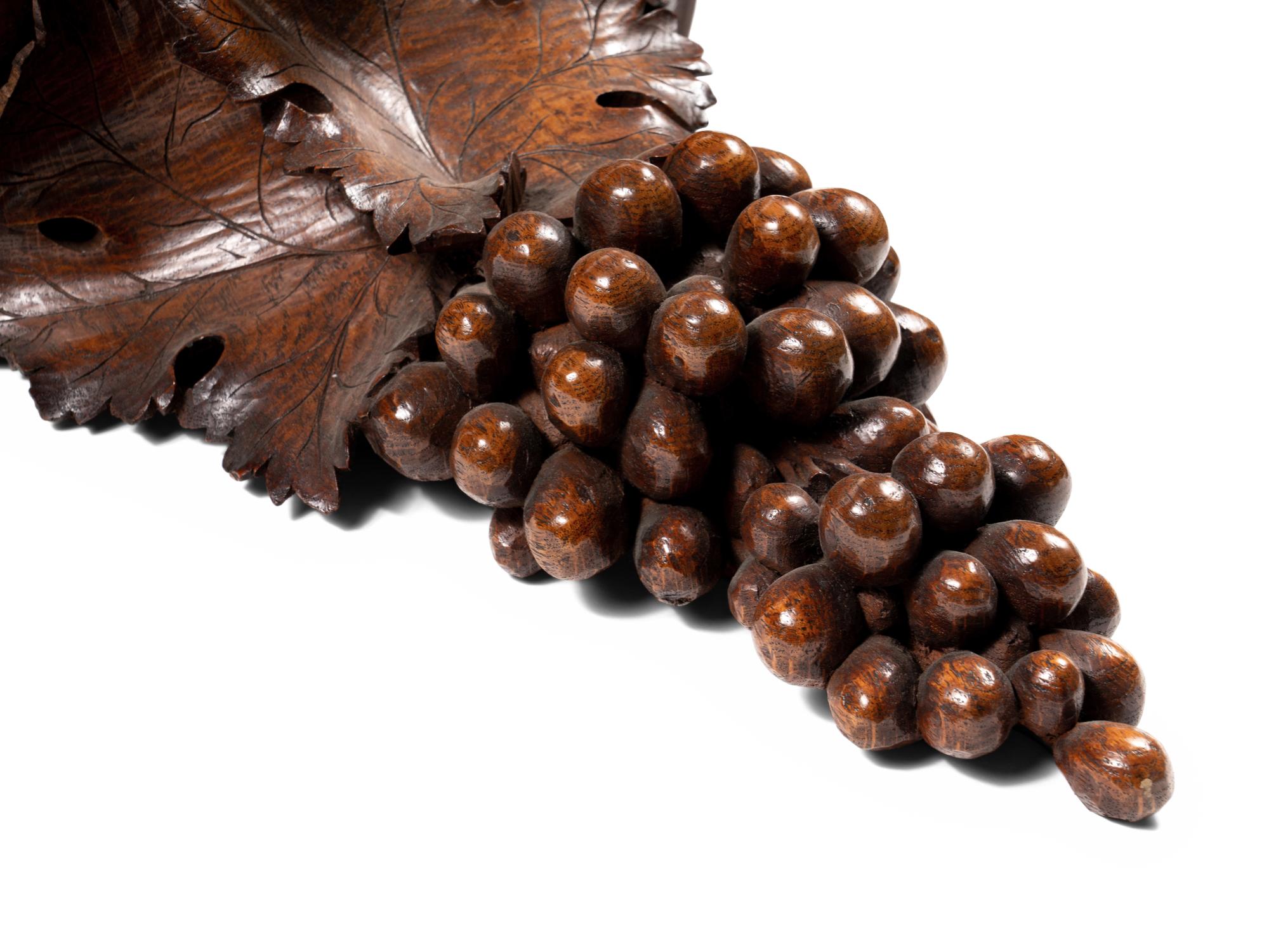 A Pair of Continental Carved Walnut Wall Brackets