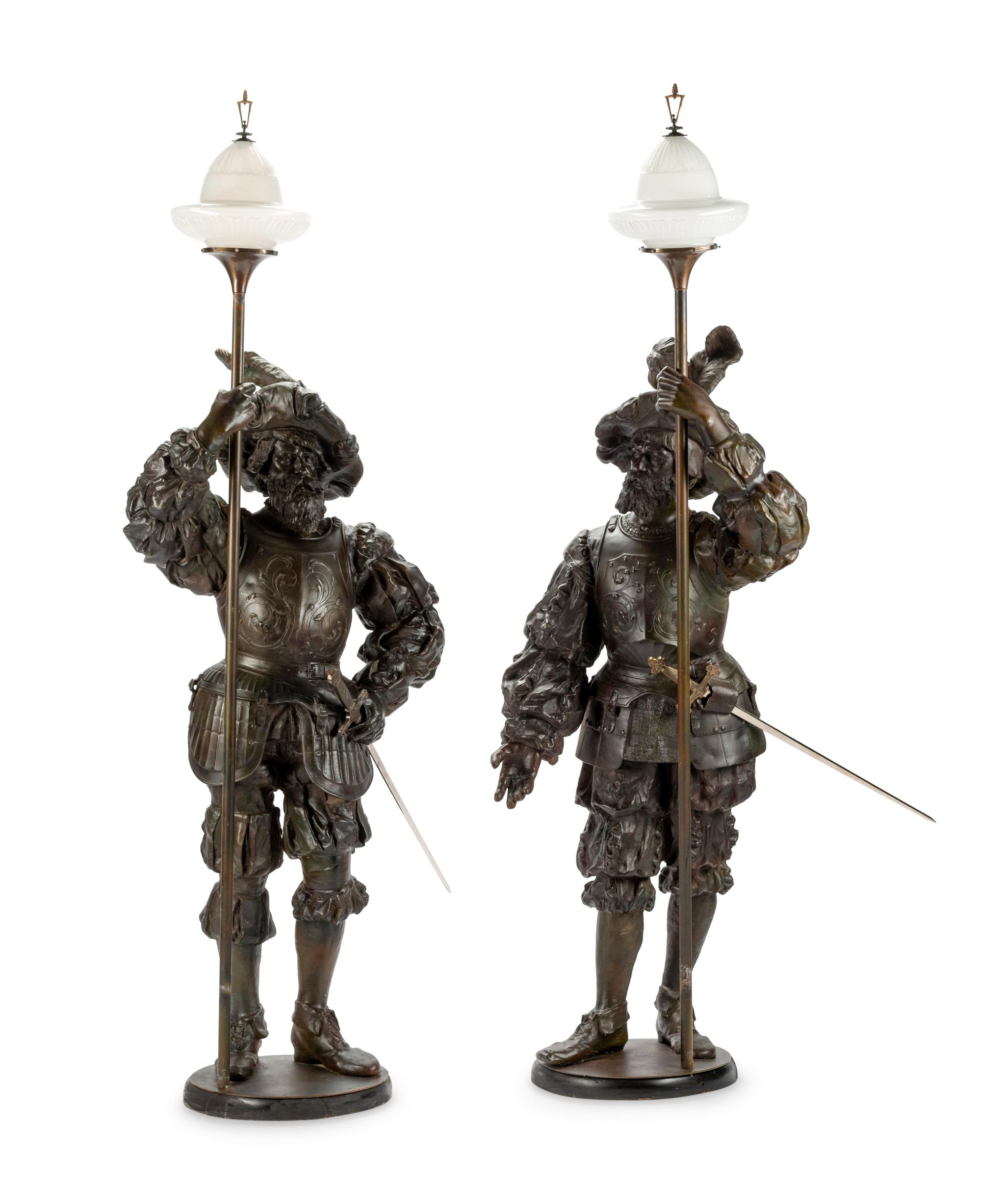 A Pair of Cast Metal Figural Torchères