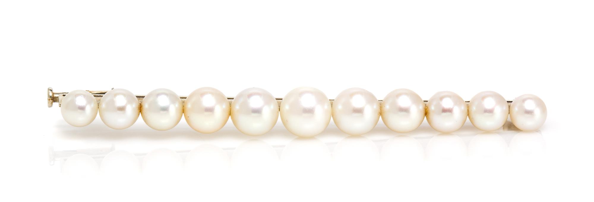 An 18 Karat White Gold and Cultured Pearl Bar Pin, French, 6.05 dwts.