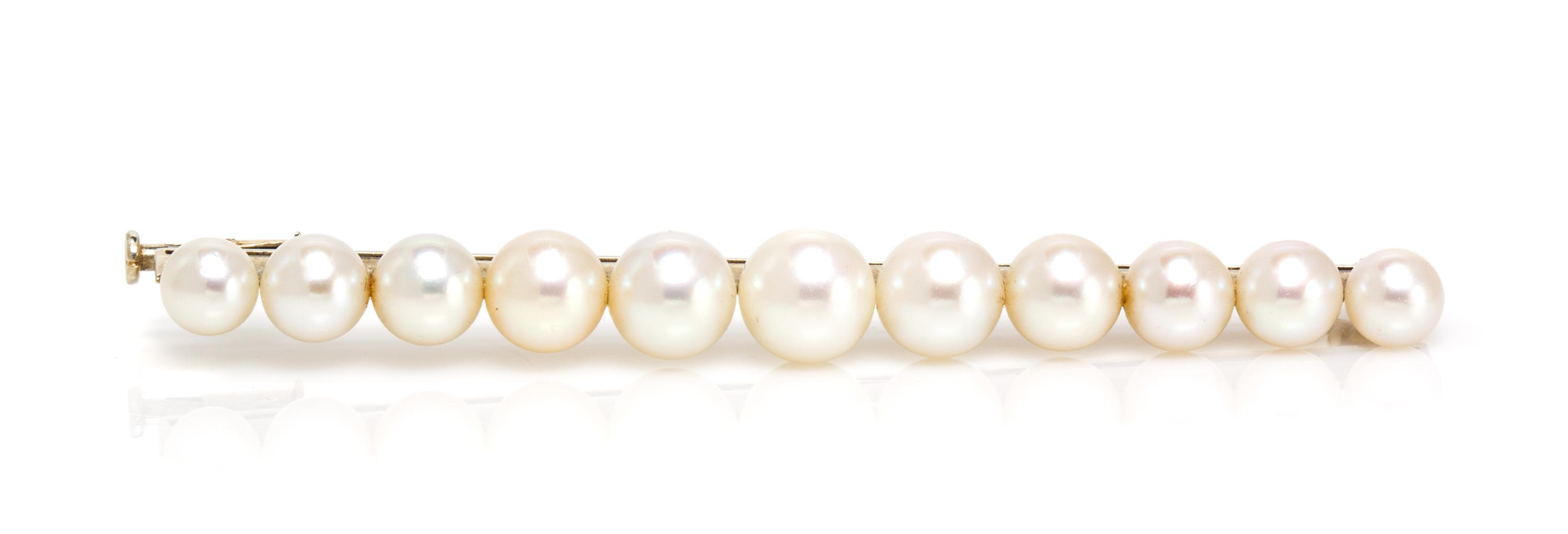 An 18 Karat White Gold and Cultured Pearl Bar Pin, French, 6.05 dwts.