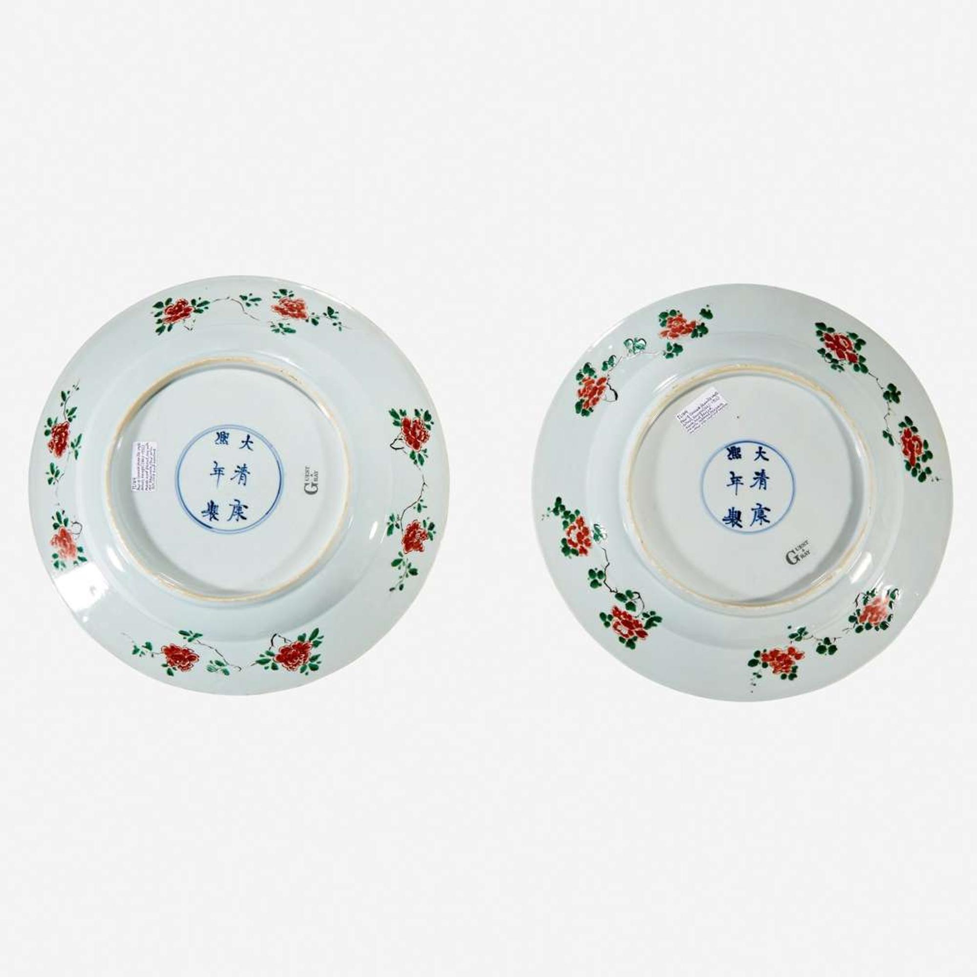 Two similar Chinese famille verte-decorated porcelain “Phoenix and Peony” dishes Kangxi six-character marks and of the period