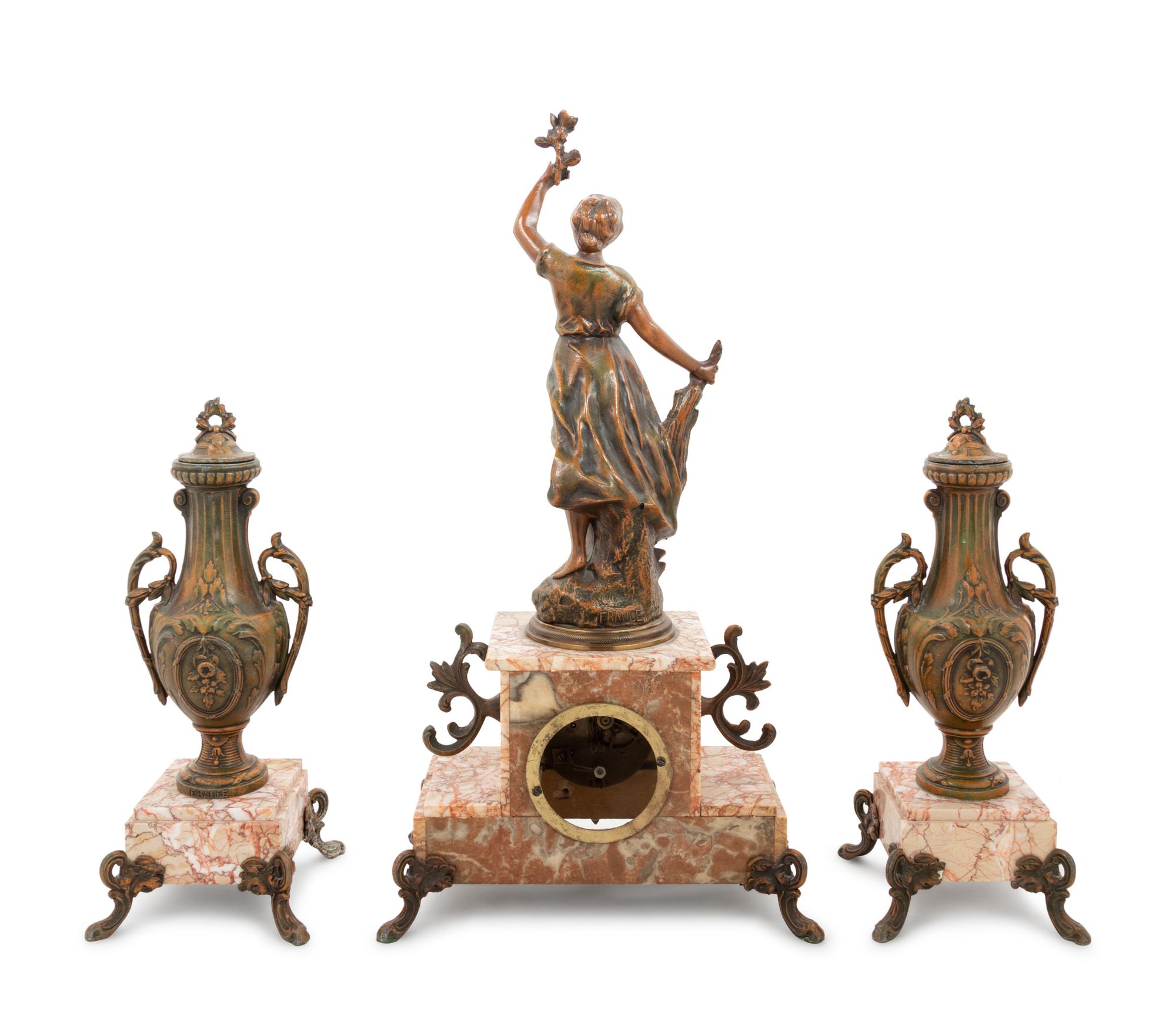 A French Cast Metal and Marble Clock Garniture