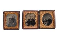 [EARLY PHOTOGRAPHY]. A group of 8 daguerreotype, ambrotype, and tintype portraits highlighted by portrait of two women with a dog.