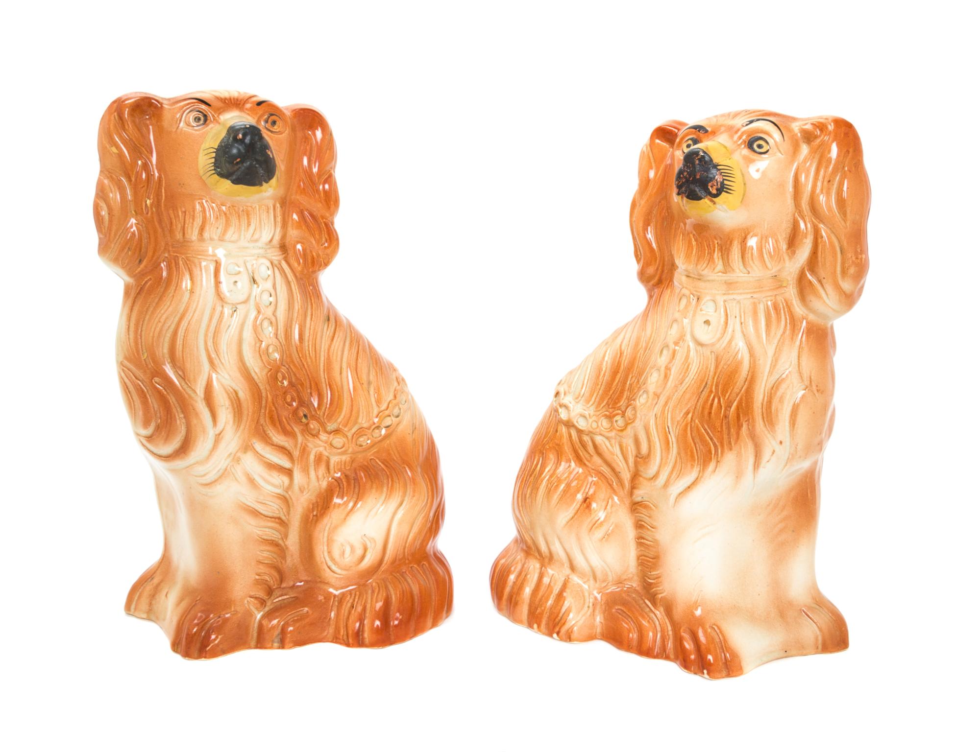 A Pair of Staffordshire Spaniels Height 8 3/4 inches. — 19TH/20TH CENTURY