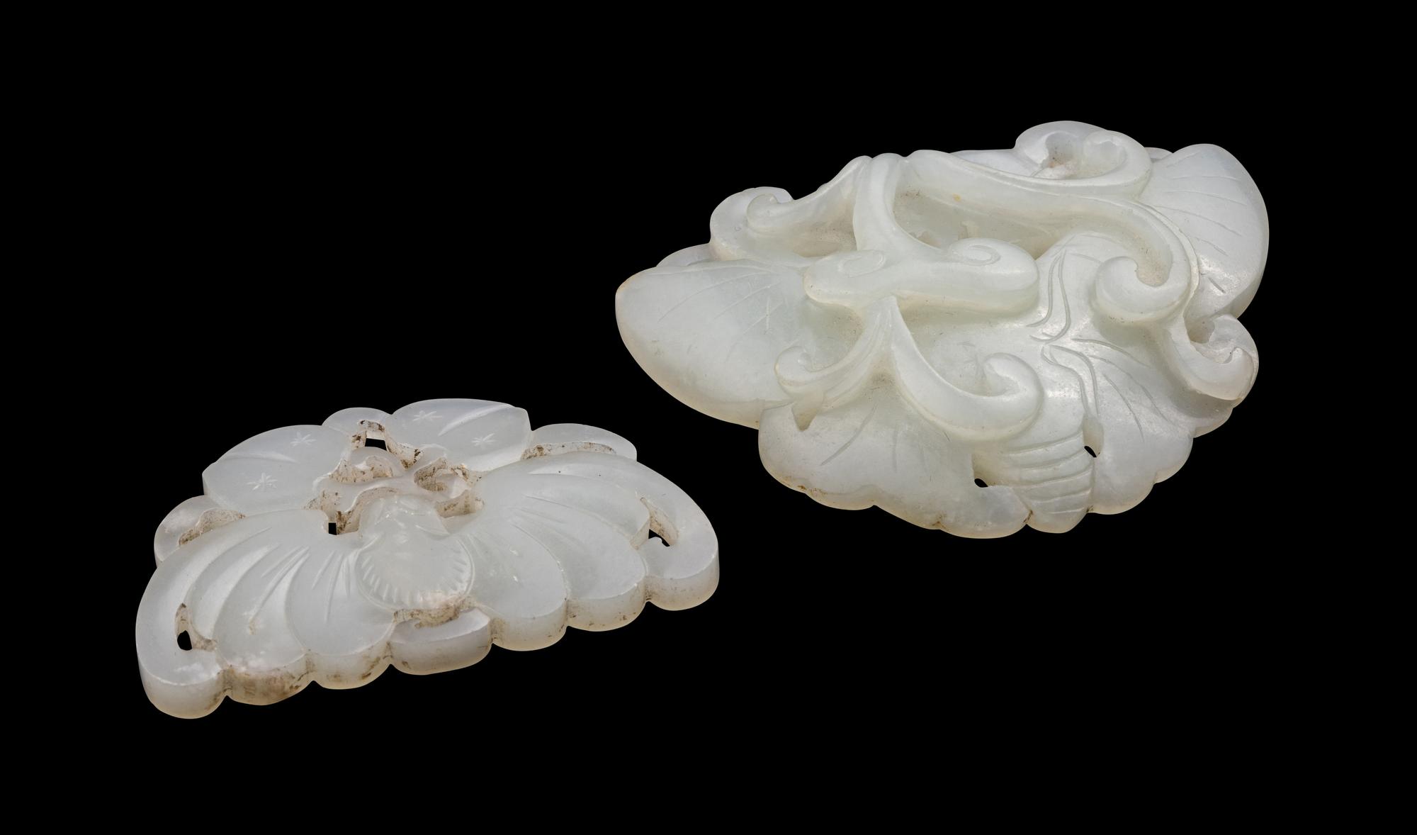 Two Chinese Carved Pale Celadon Jade Pendants