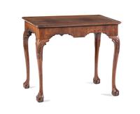 A Queen Anne Shell-Carved and Veneered Walnut Dish-Top Claw-and-Ball Foot Tea Table