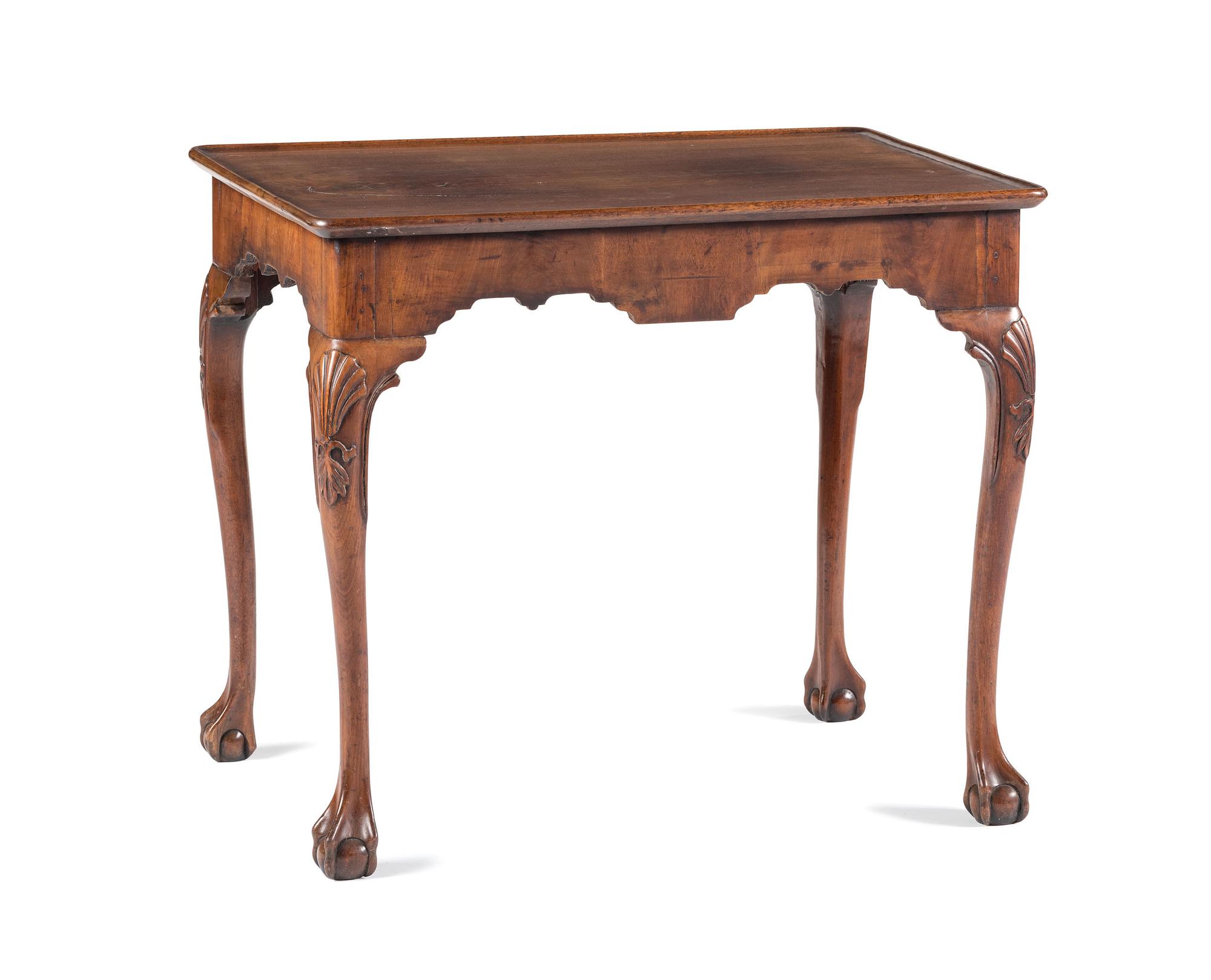 A Queen Anne Shell-Carved and Veneered Walnut Dish-Top Claw-and-Ball Foot Tea Table