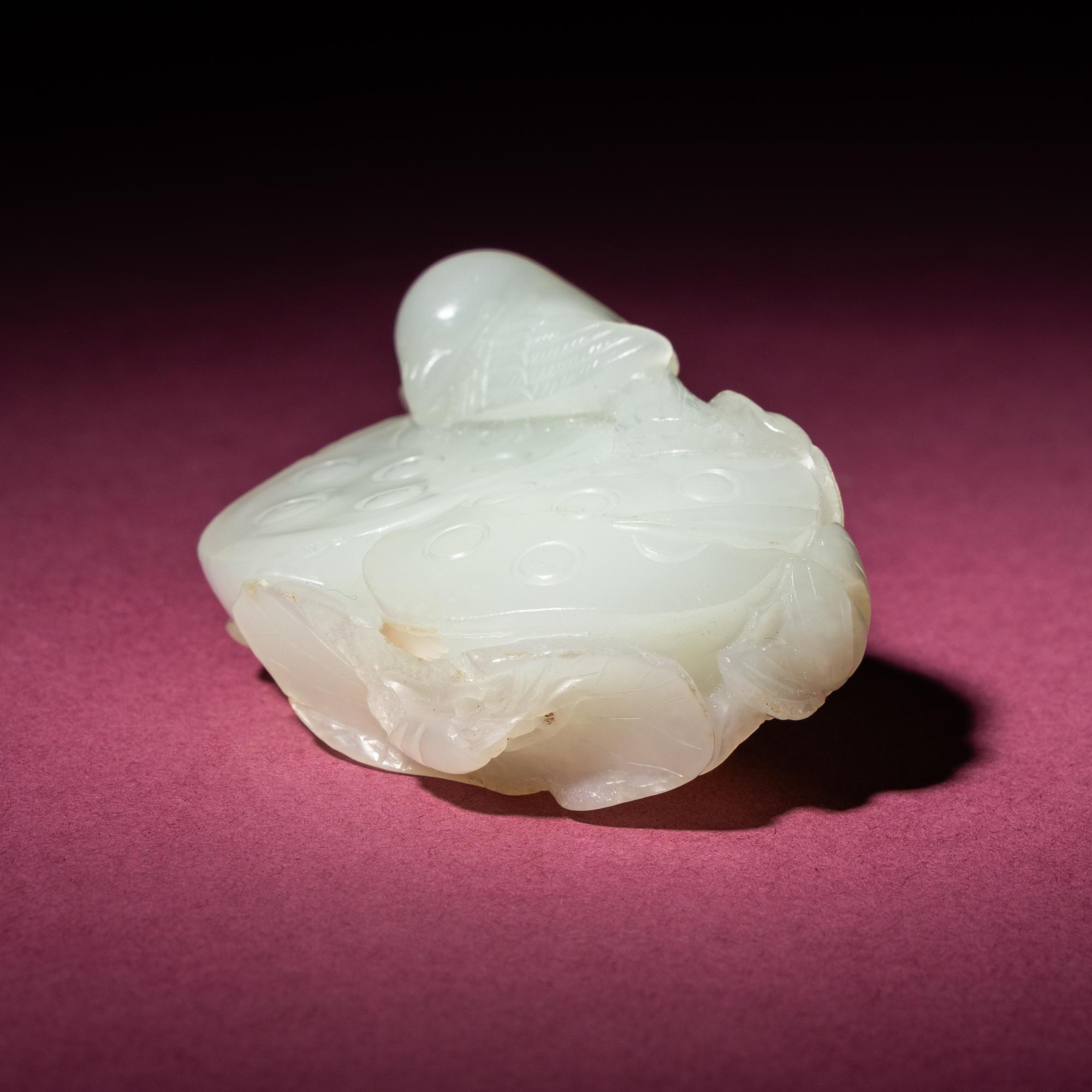 A Chinese White Jade Carving of Double Lotus Pods, 18th/19th Century — 清中期 白玉雙蓮子把件
