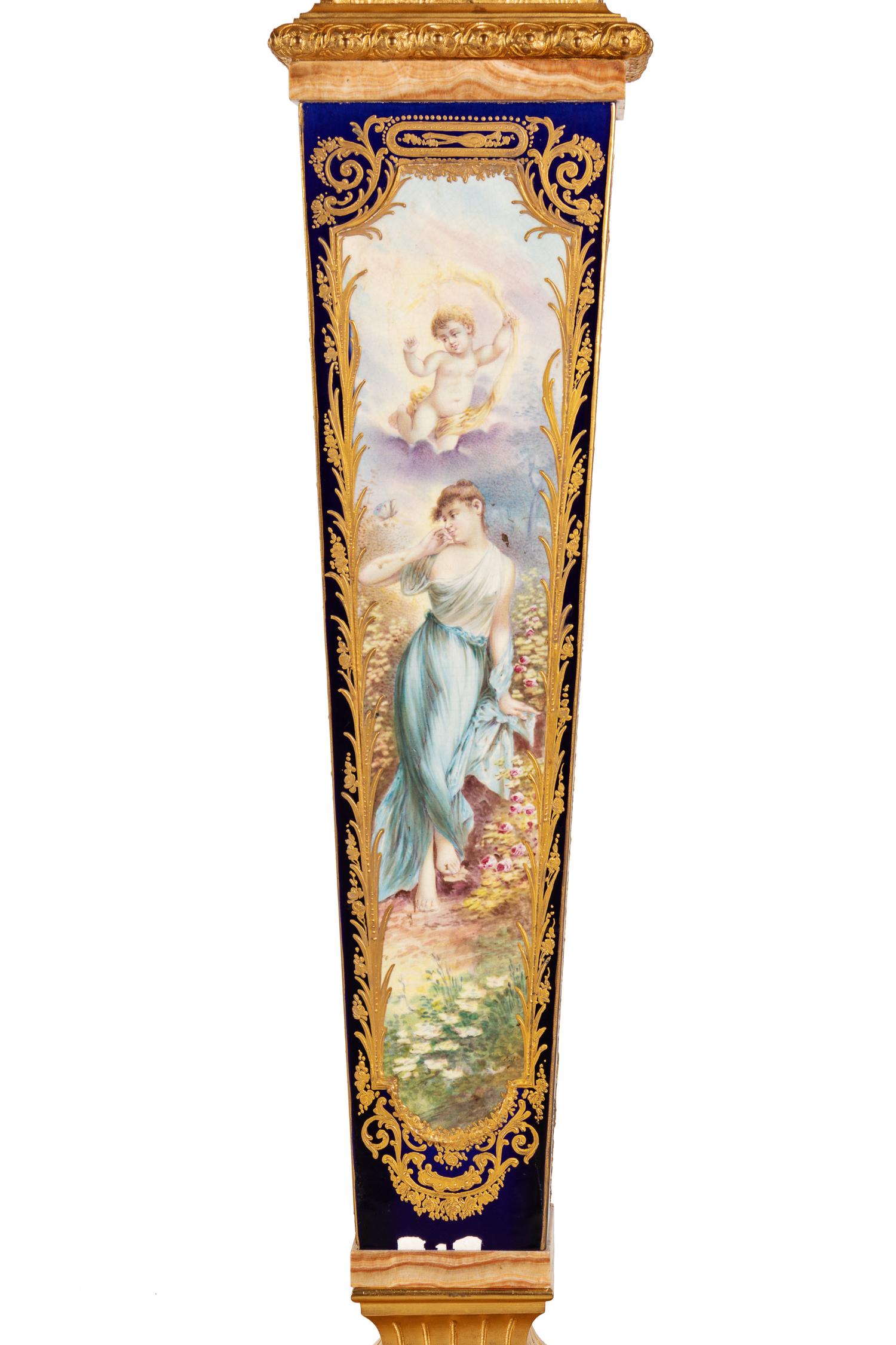 A Pair of Sèvres Style Gilt Bronze Mounted Painted and Parcel Gilt Porcelain and Onyx Pedestals