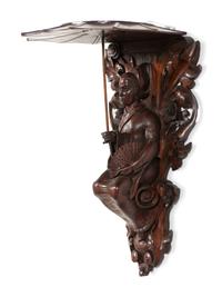 A Pair of Carved Oak Figural Wall Brackets