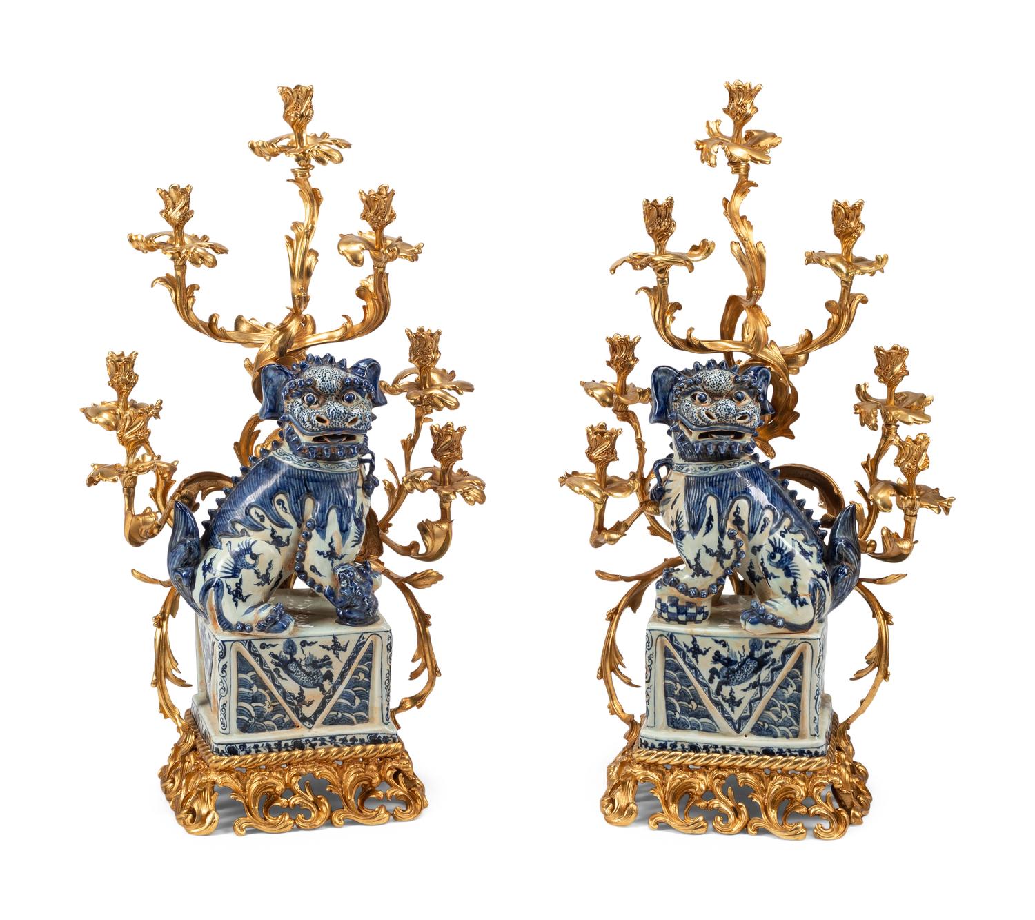 A Pair of Large Gilt Bronze Mounted Porcelain Temple Lion Candelabra