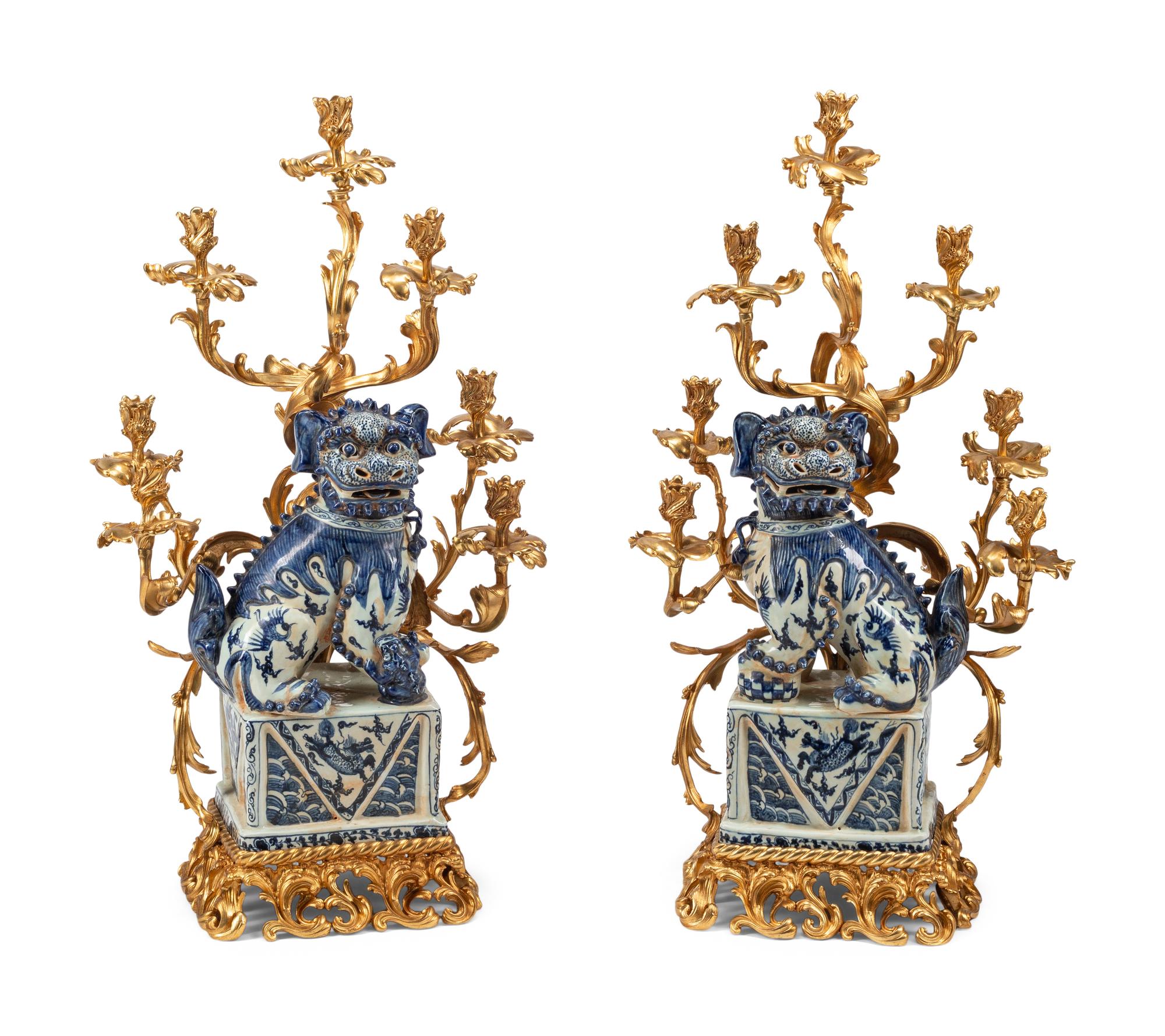 A Pair of Large Gilt Bronze Mounted Porcelain Temple Lion Candelabra