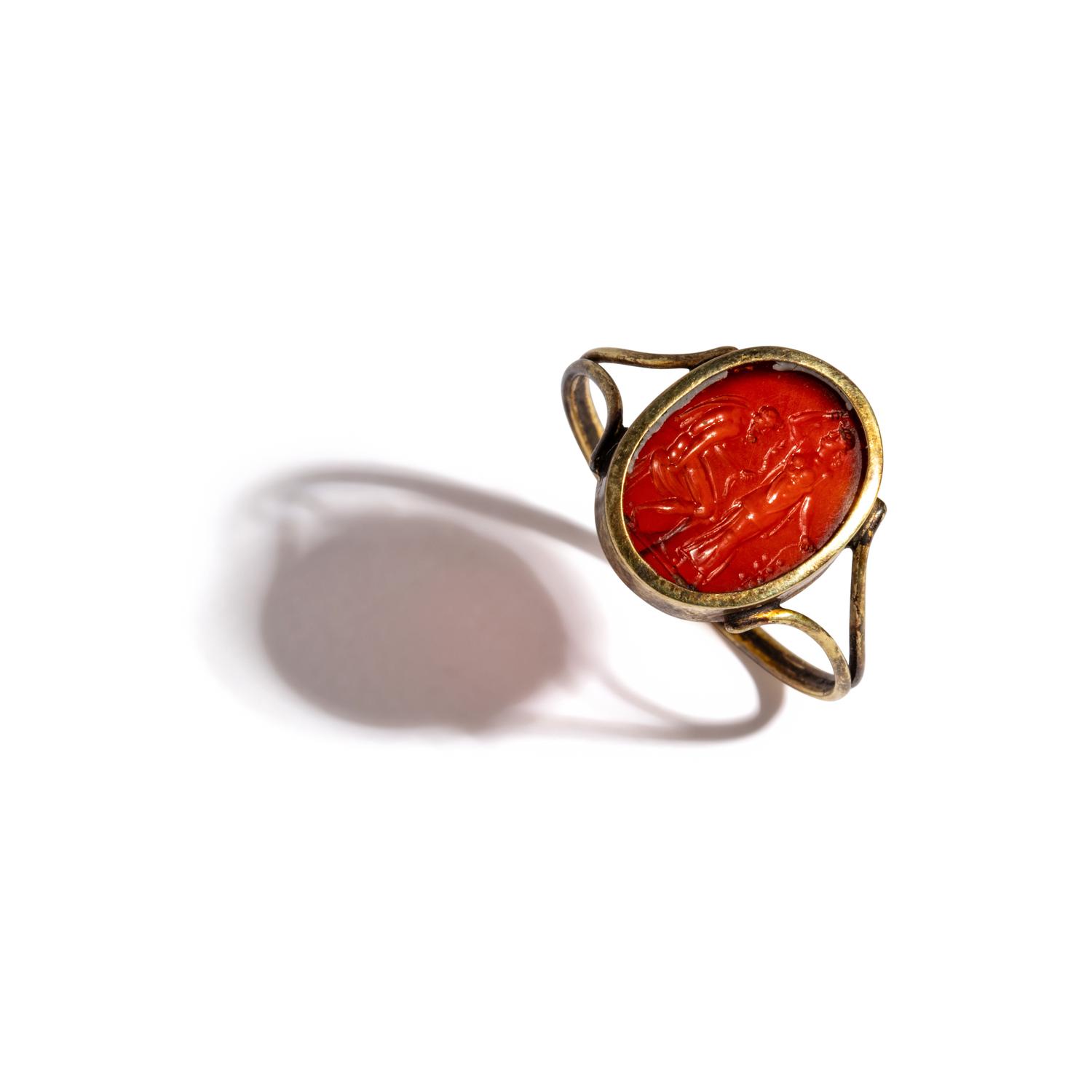 A Neoclassical Carnelian and Gold Finger Ring with a Laurel Branch Offering