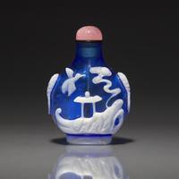 A Chinese White Overlay Blue Glass Snuff Bottle, Qing Dynasty, Possibly 18th-Early 19th Century 清中期 寶石藍地套涅白料垂釣圖鼻烟壺