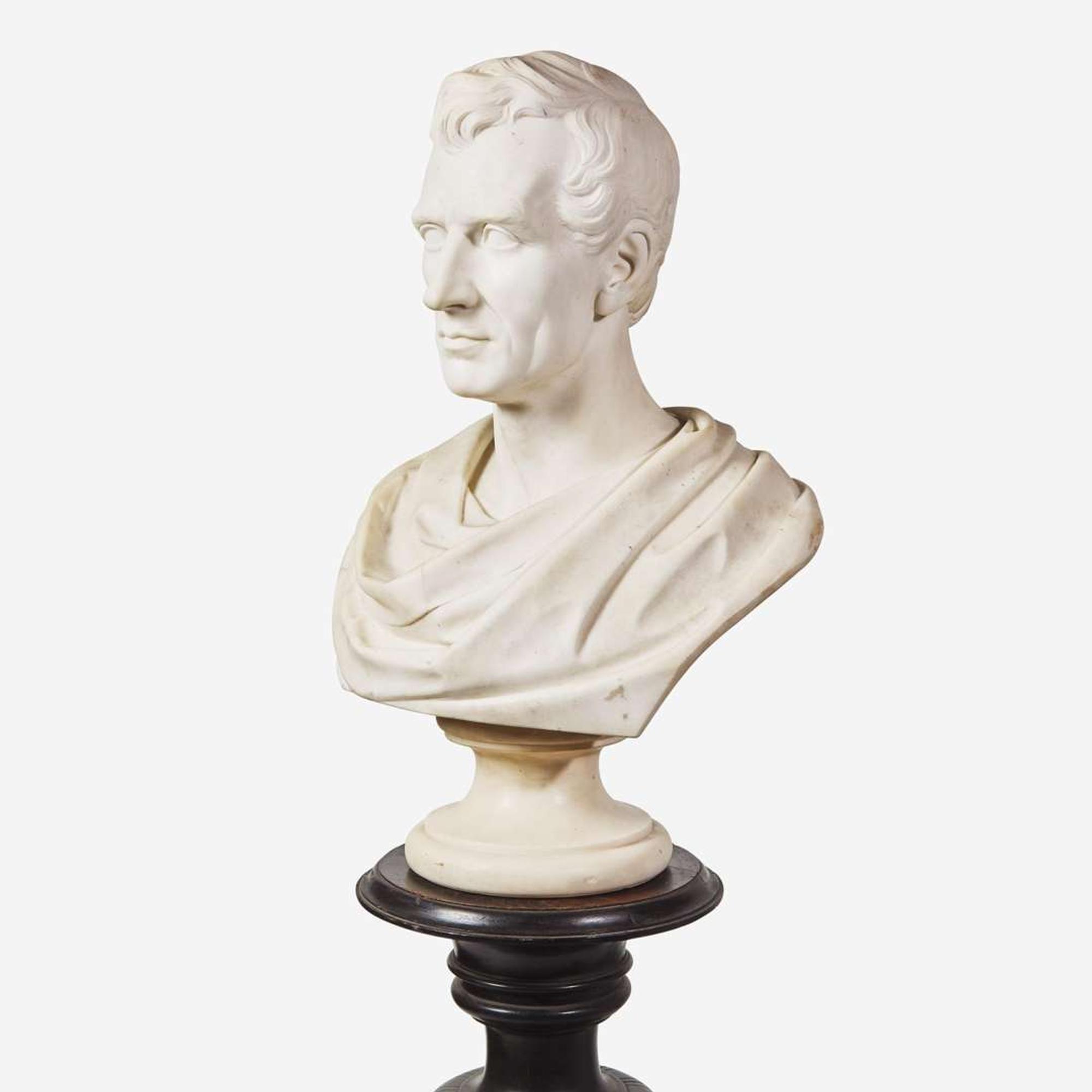 A carved Carrara marble bust of a Classically draped gentleman 19th century