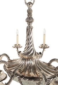 A Continental Silvered Bronze and Frosted Glass Eight-Light Chandelier