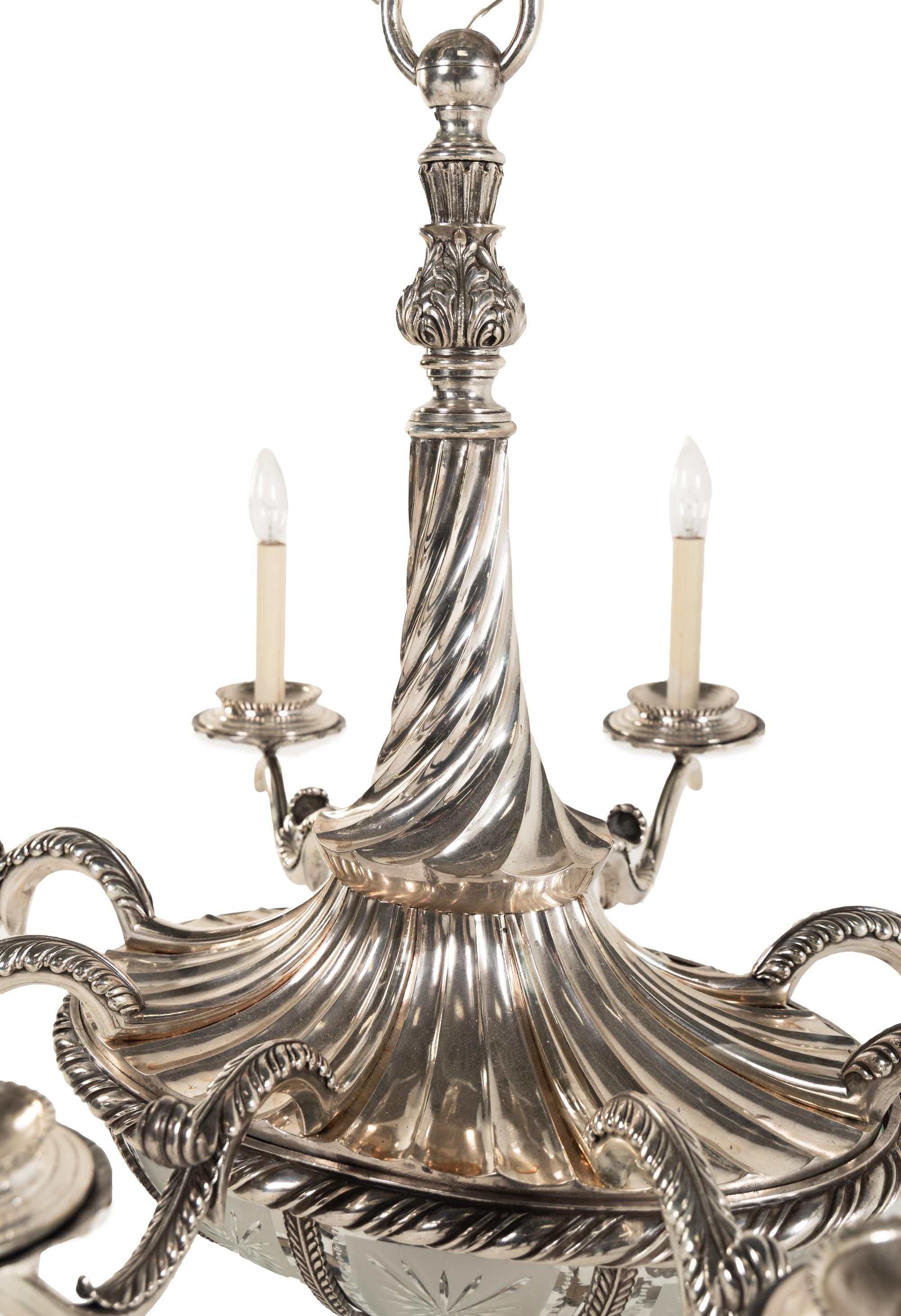 A Continental Silvered Bronze and Frosted Glass Eight-Light Chandelier